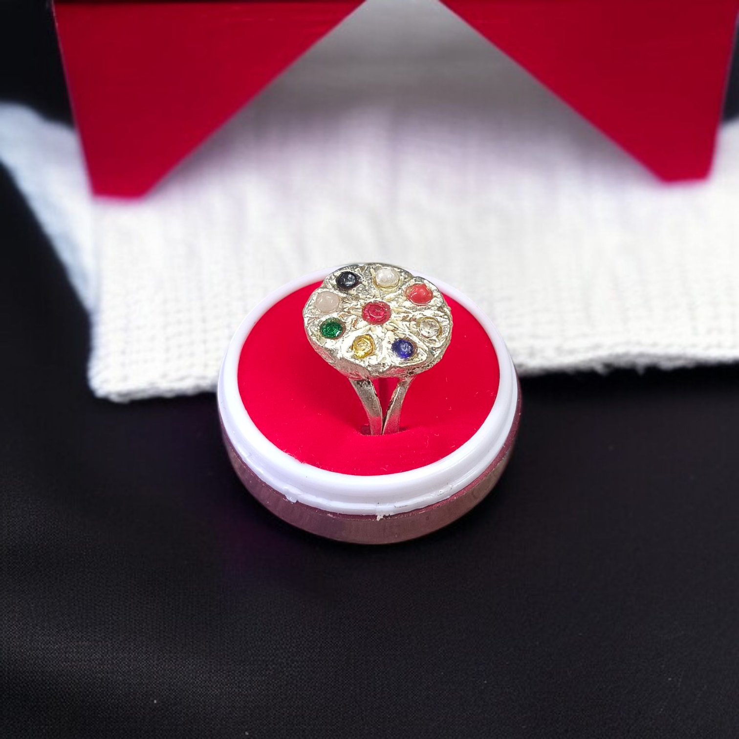 Oval-shaped Navratan Ring with silver plating, featuring nine gemstones for astrological balance and spiritual