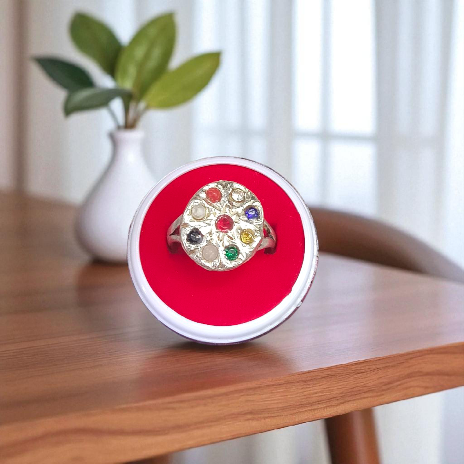 Oval-shaped Navratan Ring with silver plating, featuring nine gemstones for astrological balance and spiritual