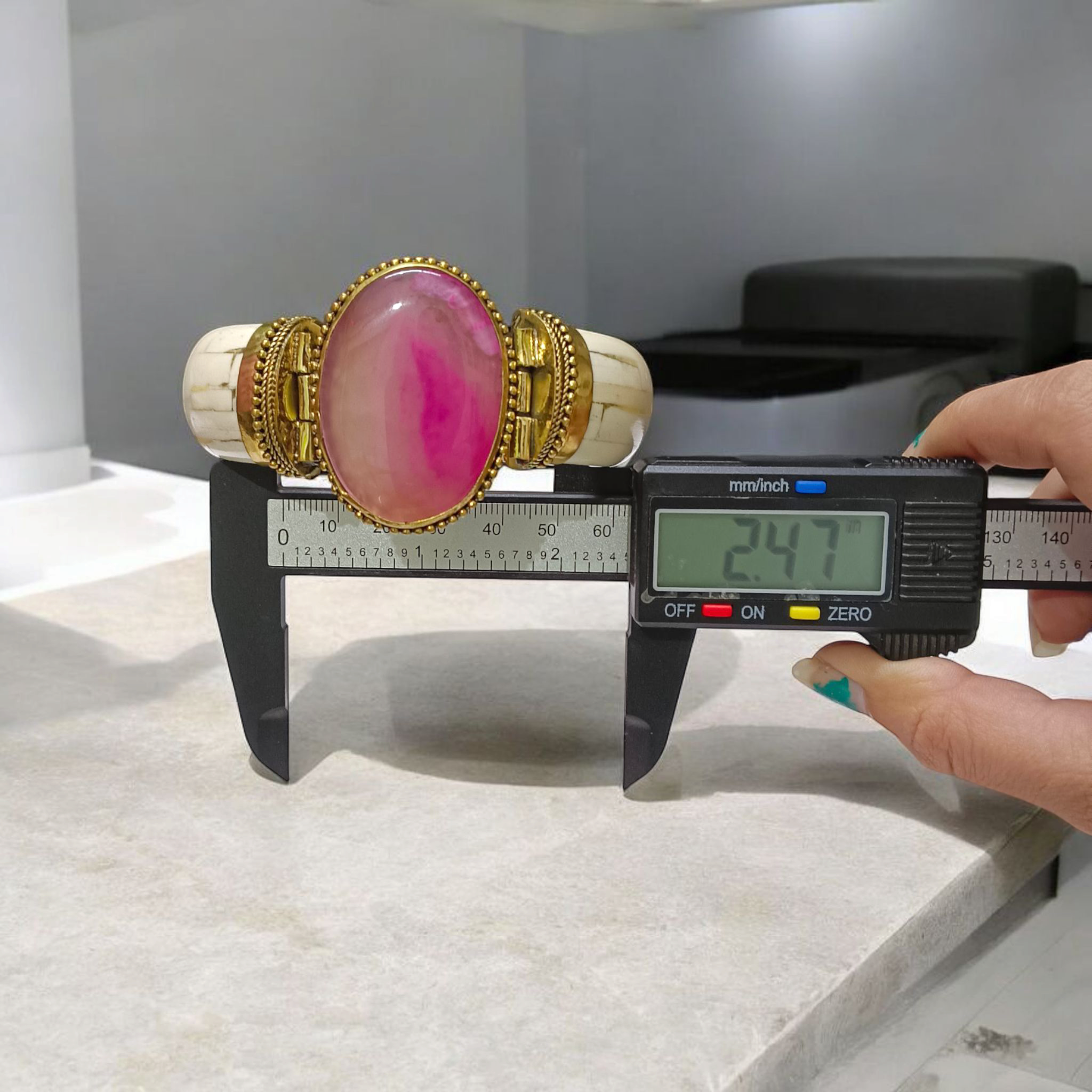 Pink Agate Bracelet with natural, lab-certified pink hakik stones, handcrafted in an antique finish, placed on a soft, feminine background