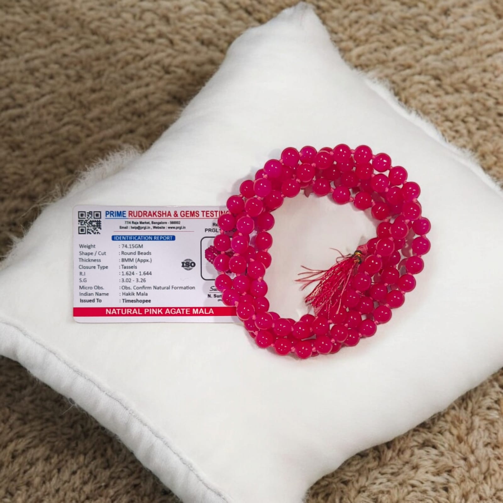Pink Agate Mala with 8MM beads and 108+1 bead count, lab-certified for authenticity, displayed in a close-up view showing its delicate pink hues.