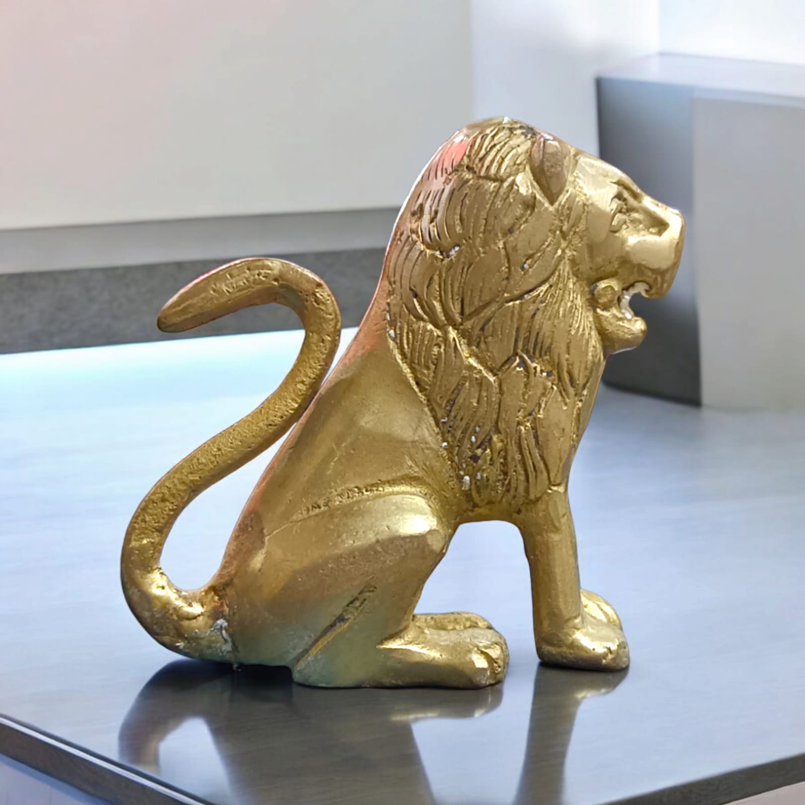 Pure Brass Lion Idol with intricate craftsmanship, perfect for table or temple decoration.