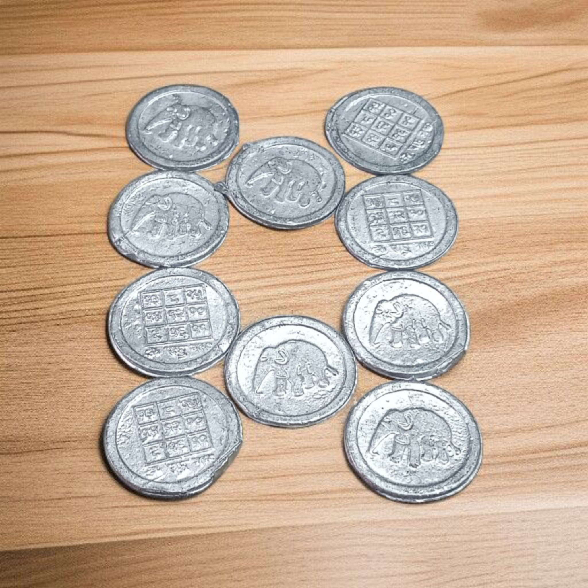 Ranga Rahu Yantra Coin featuring intricate designs, used for remedies against Rahu’s malefic effects, suitable for carrying or placement in home or office