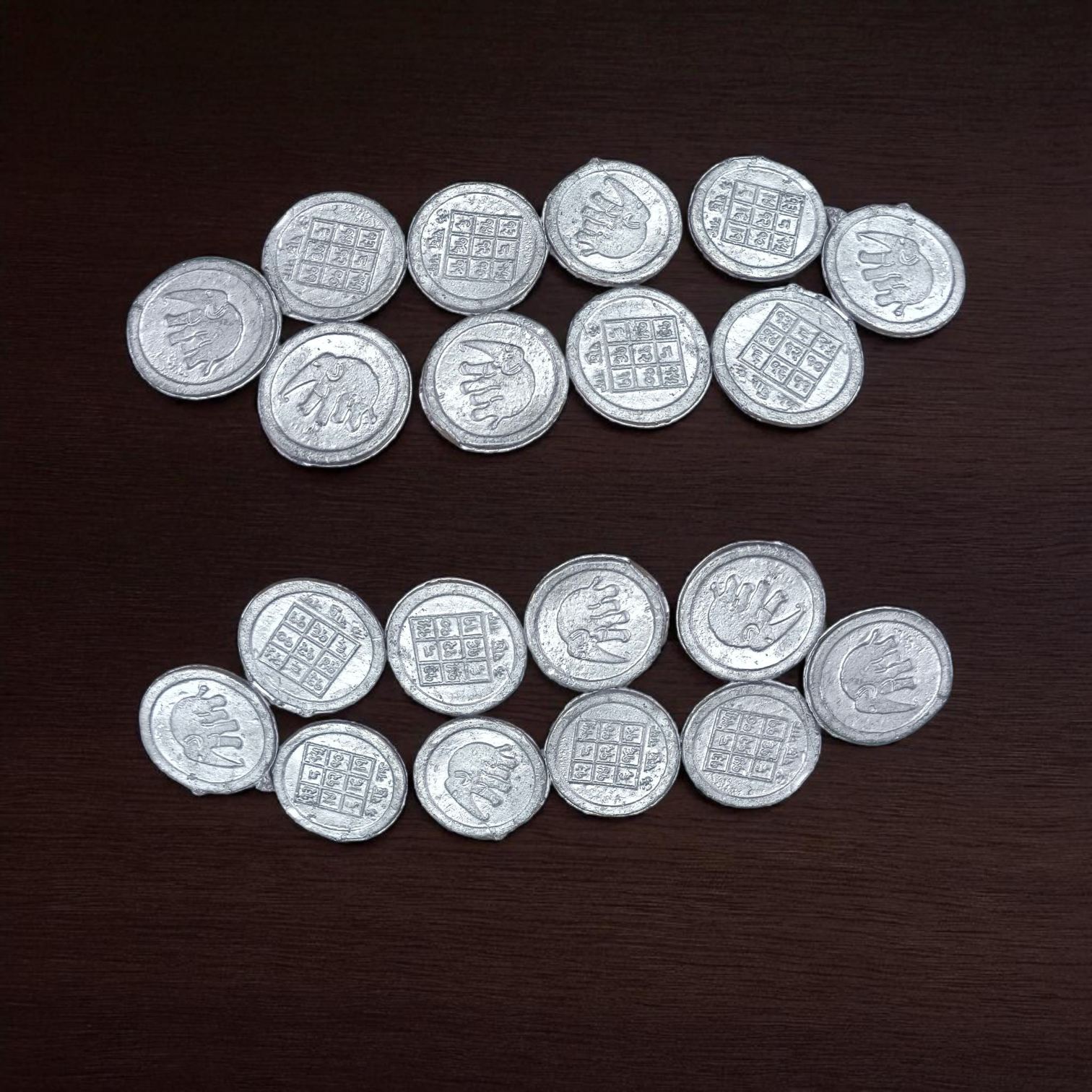 Ranga Rahu Yantra Coin featuring intricate designs, used for remedies against Rahu’s malefic effects, suitable for carrying or placement in home or office