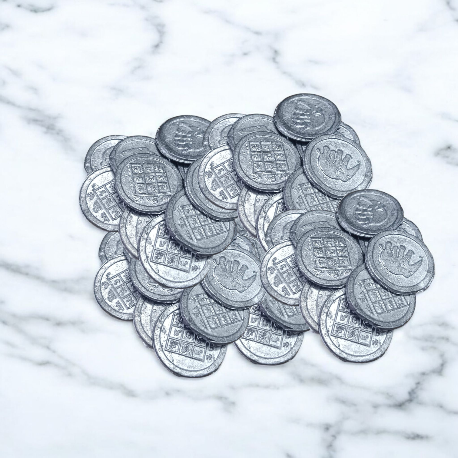 Ranga Rahu Yantra Coin featuring intricate designs, used for remedies against Rahu’s malefic effects, suitable for carrying or placement in home or office