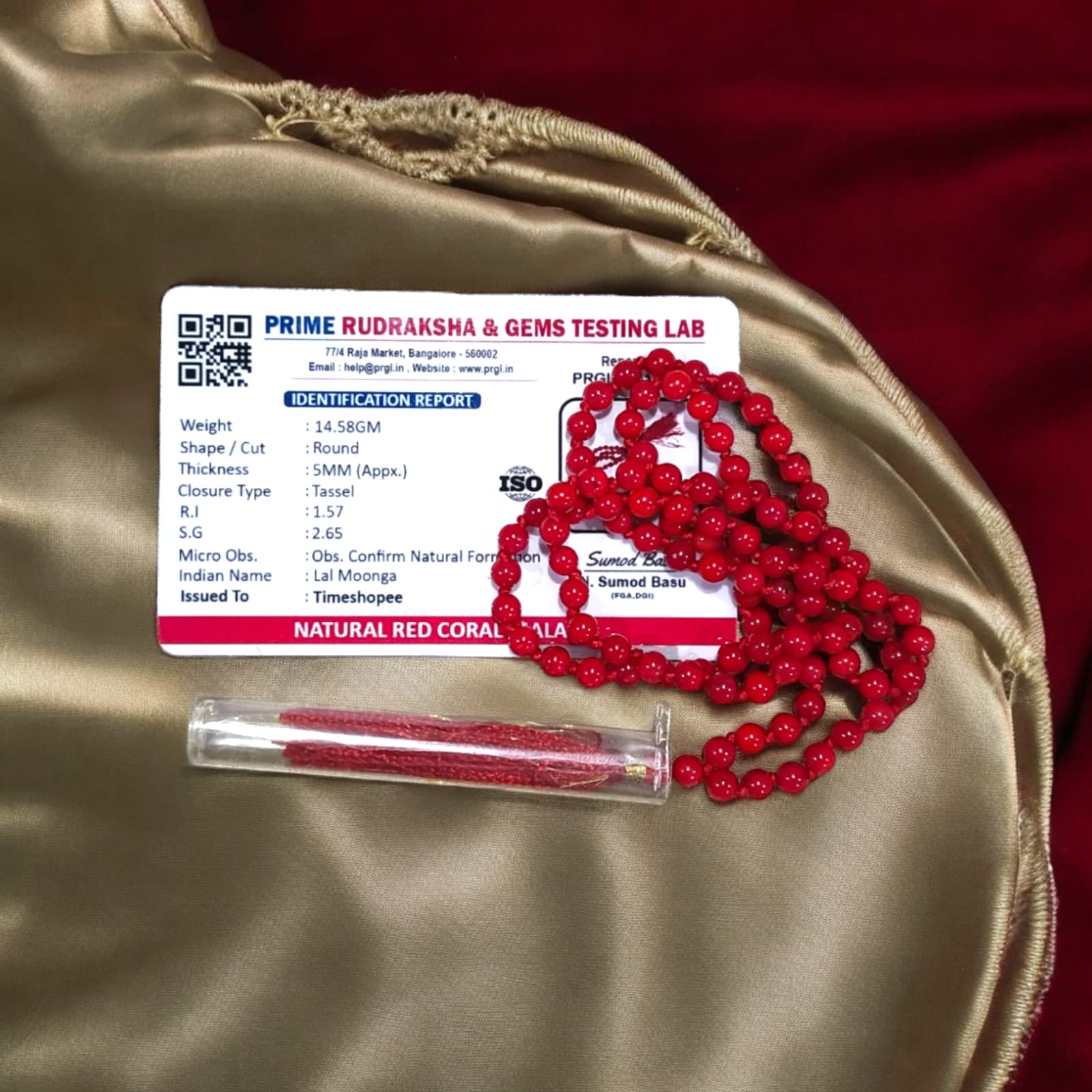 Red Coral Mala with 5MM beads and 108+1 bead count, lab-certified for authenticity, displayed in a close-up view showcasing its vibrant red color.