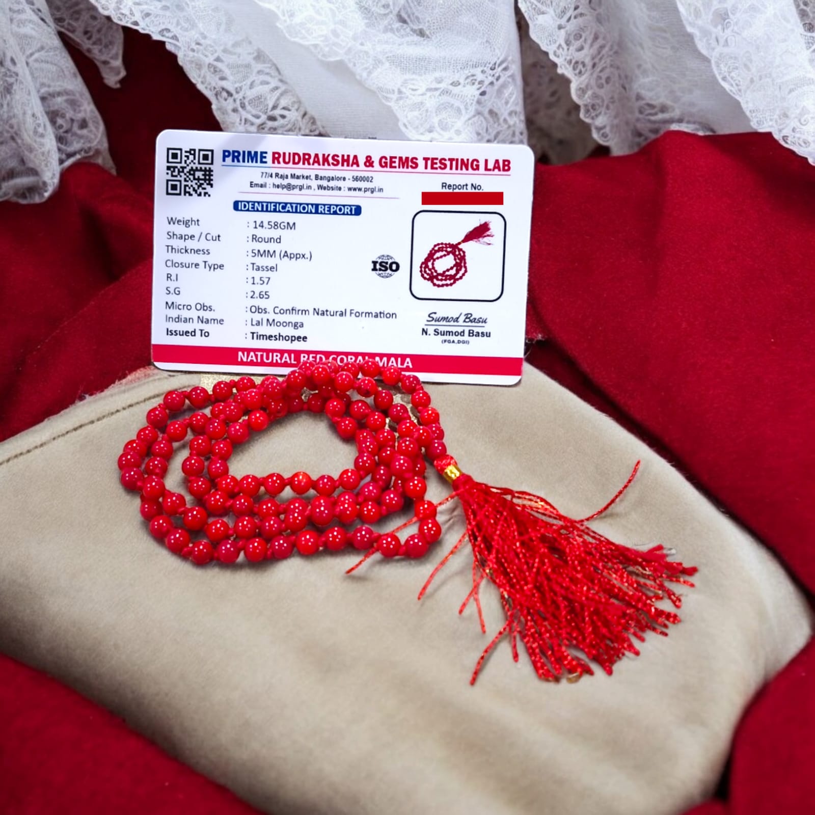 Red Coral Mala with 5MM beads and 108+1 bead count, lab-certified for authenticity, displayed in a close-up view showcasing its vibrant red color.