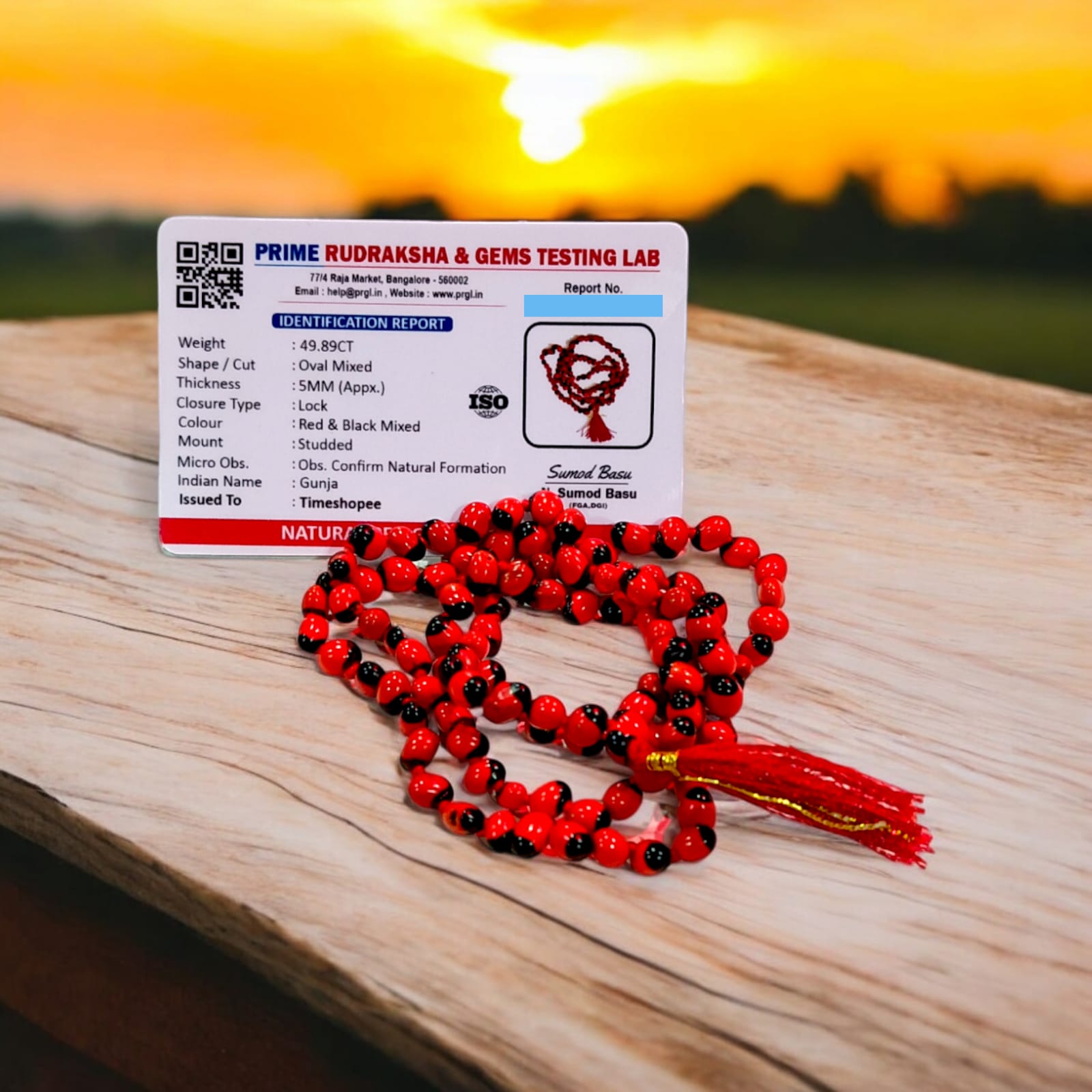 Red Gunja Mala displayed with its vivid red beads, illustrating its 100% original quality and lab certification for purity.