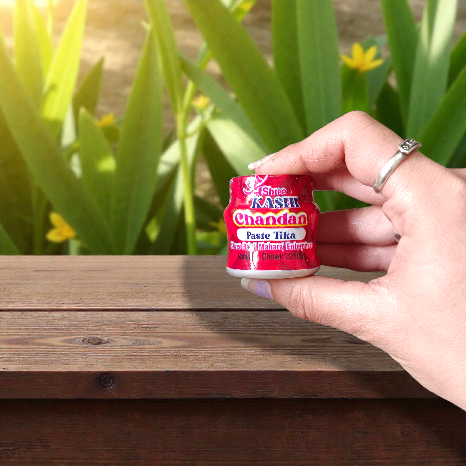 Red chandan paste container used for tilak, puja, and religious rituals