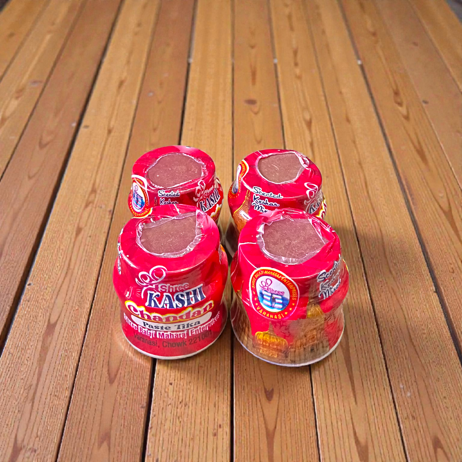 Red chandan paste container used for tilak, puja, and religious rituals