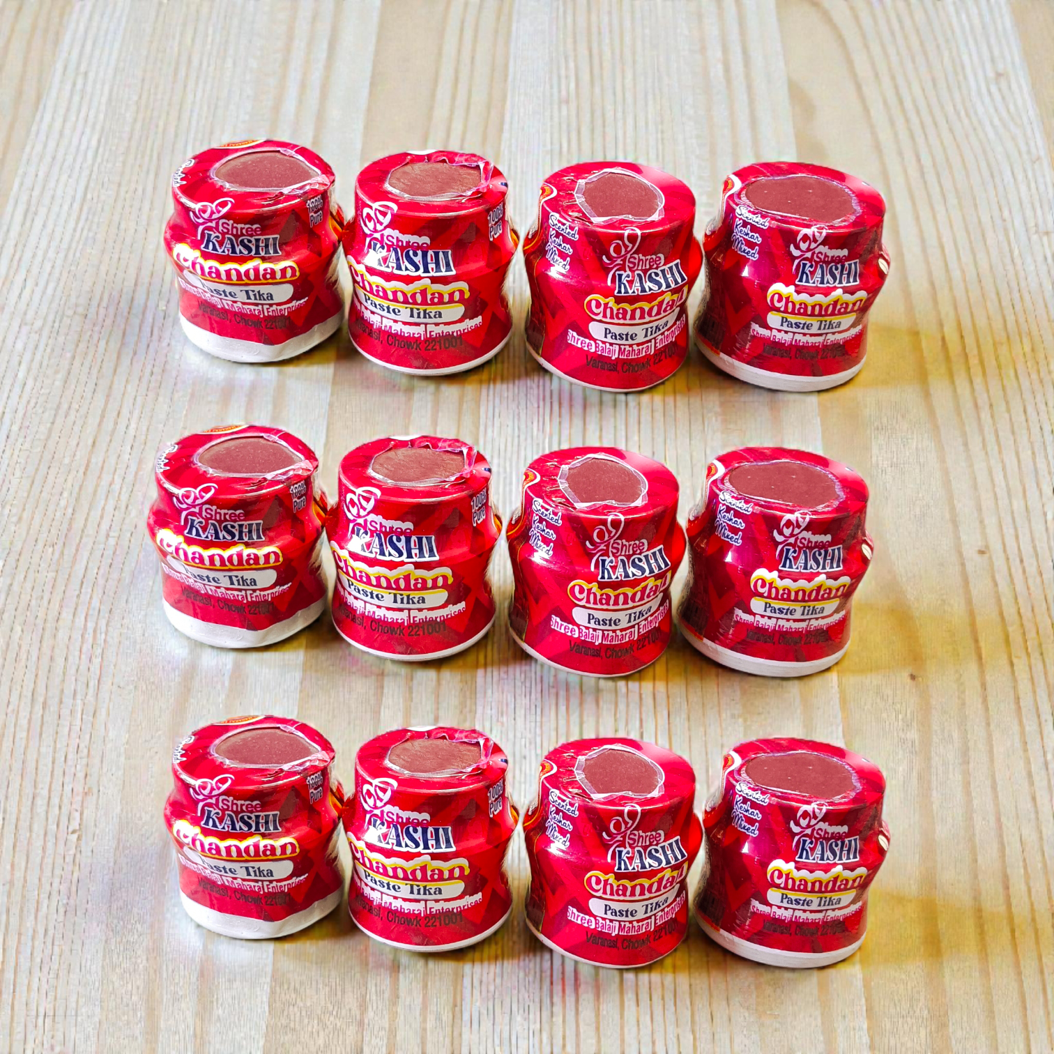 Red chandan paste container used for tilak, puja, and religious rituals