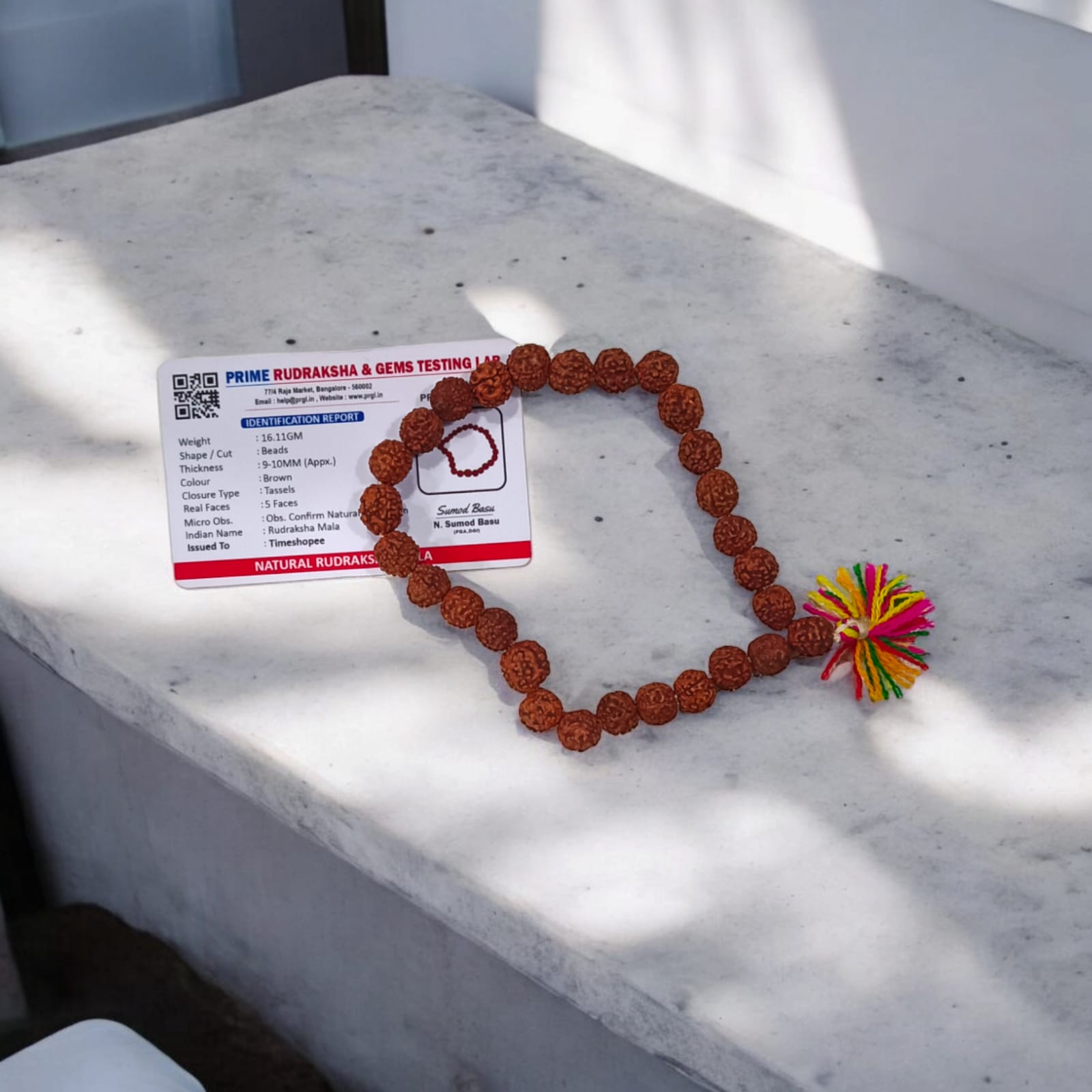 Rudraksha Mala with 27+1 beads, lab certified and 5 Mukhi, showcasing the 8mm beads and its suitability for chanting mantras.