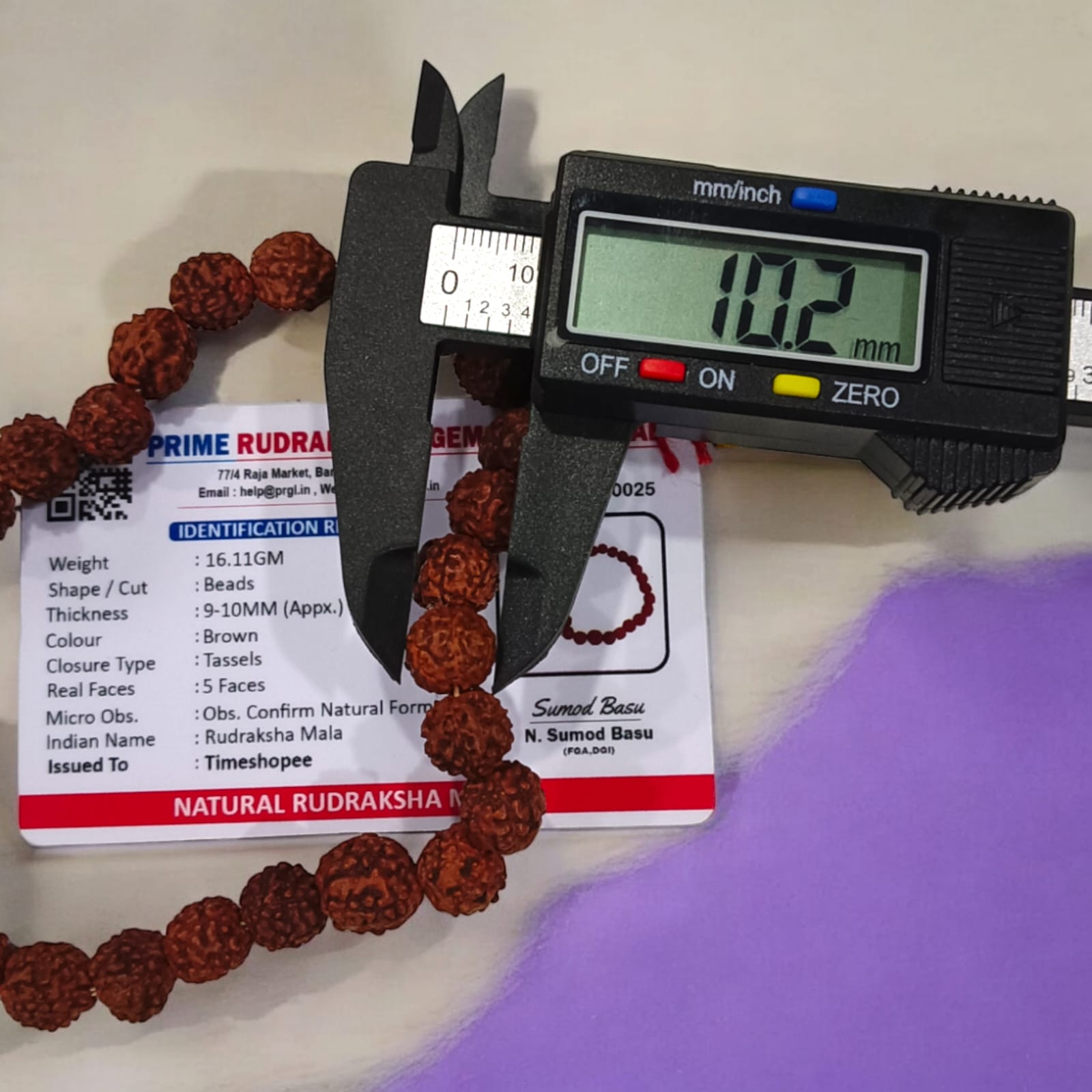 Rudraksha Mala with 27+1 beads, lab certified and 5 Mukhi, showcasing the 8mm beads and its suitability for chanting mantras.