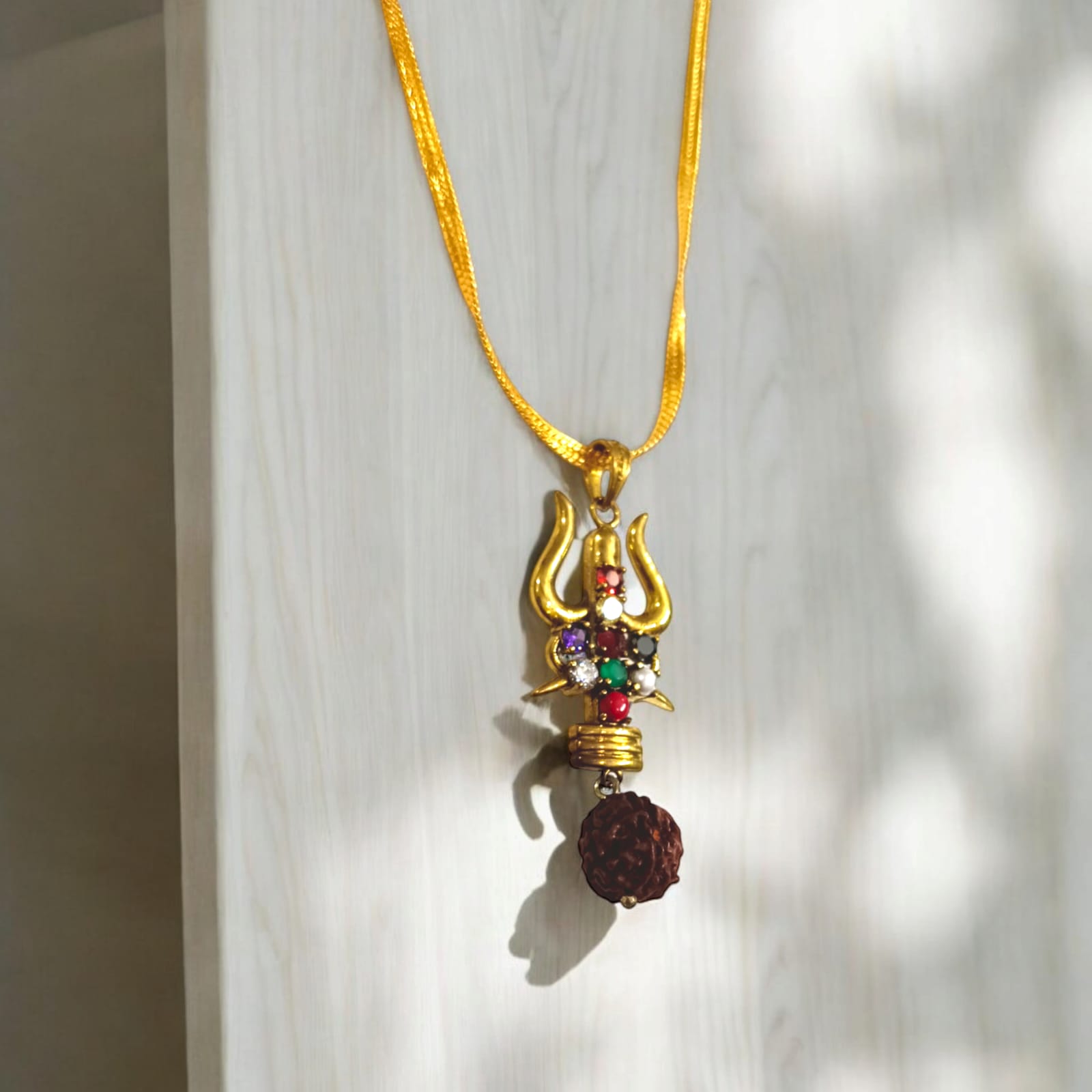 Rudraksha Trishul Locket with Gold-Finished Chain and Navratna Gemstones by Timeshopee