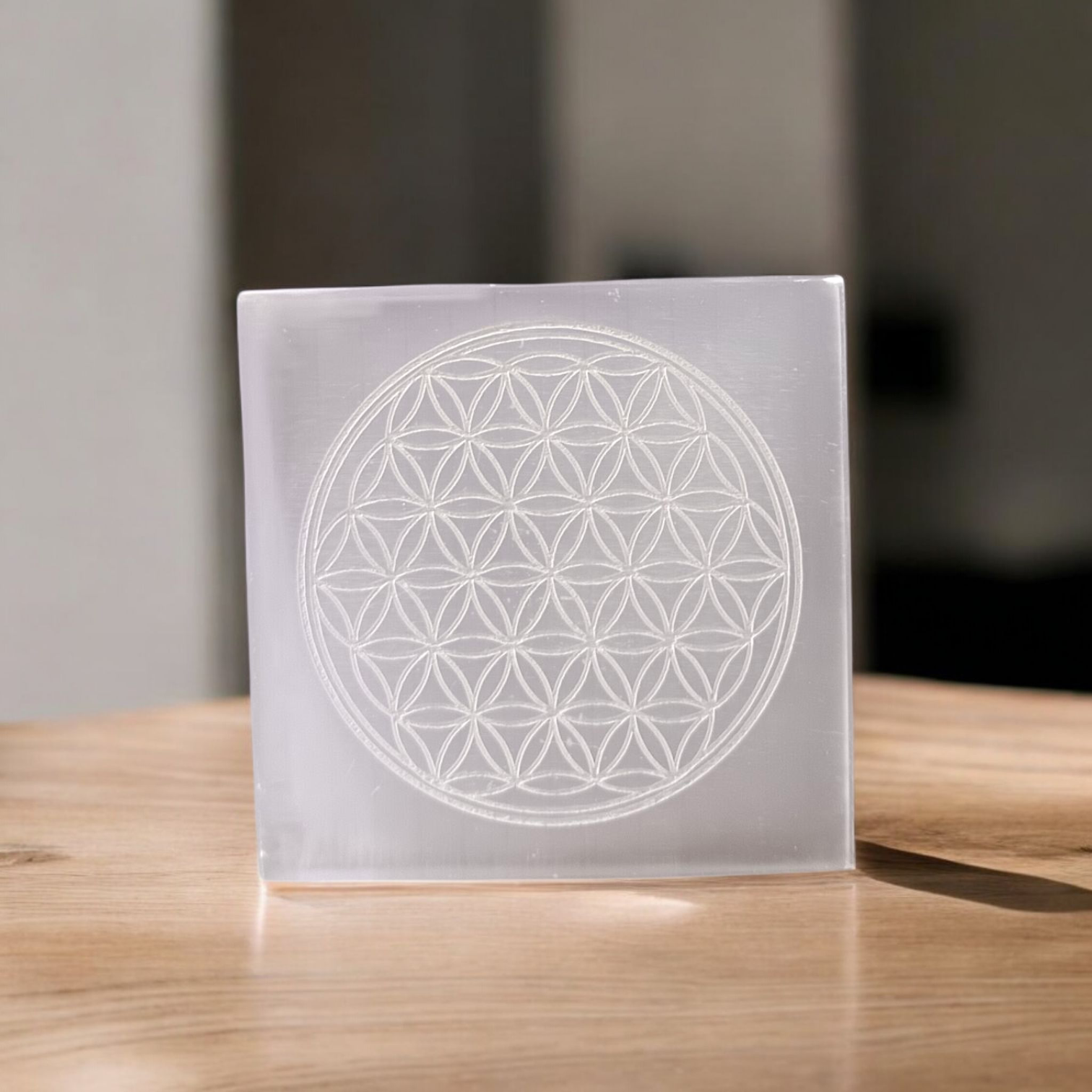 Selenite Crystal Charging Plate engraved with Flower of Life for crystal cleansing, recharging, meditation, and energy work