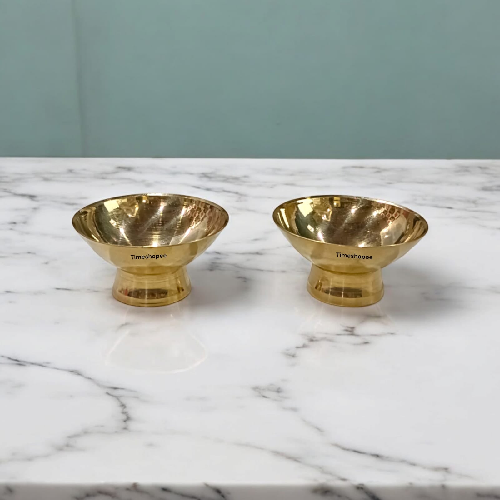 Set_of_2_brass_bowls_for_Chandan_and_Kum_Kum_perfect_for_devotional_rituals_and_elegant_altar_decoration.