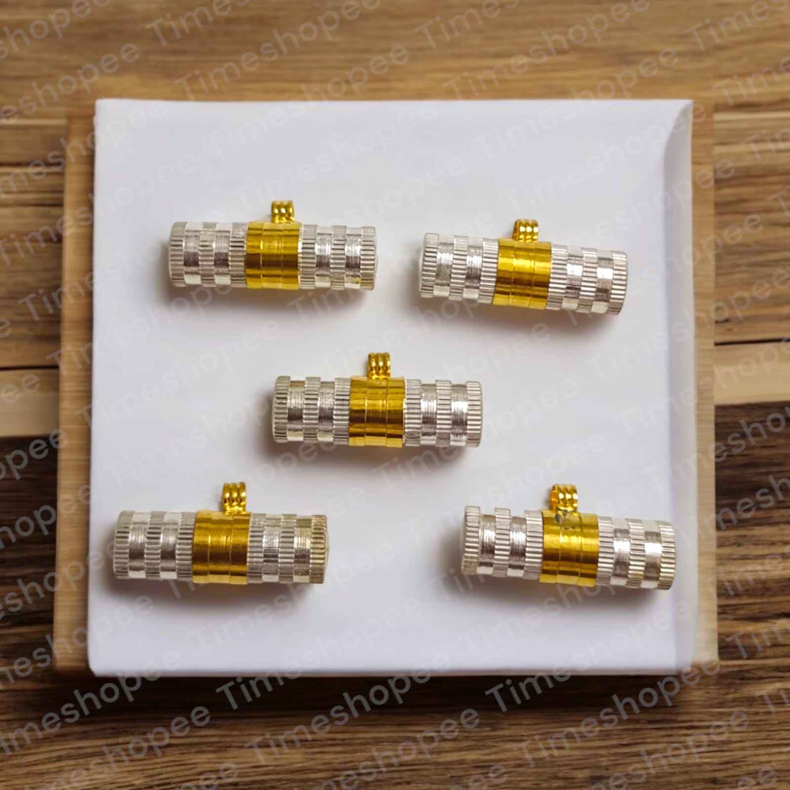 Set of Pure Brass and Silver taweezes with Bhojpatra sheet, displayed elegantly on a neutral background