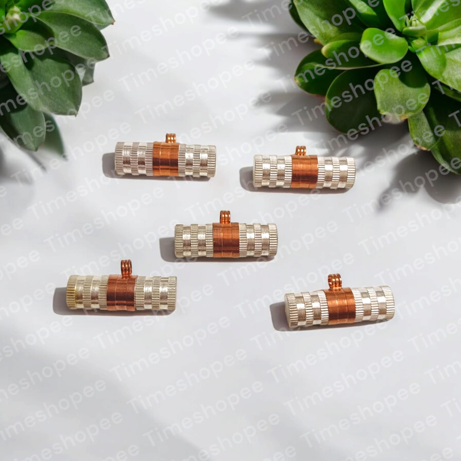 Set of Pure Copper and Silver taweezes with Bhojpatra sheet, displayed elegantly on a neutral background