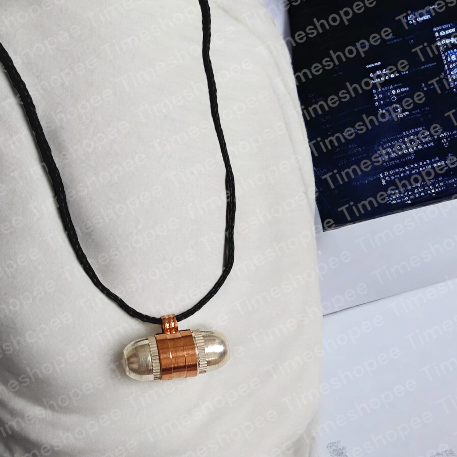 Set of Pure Copper and Silver taweezes with a Bhojpatra sheet, displayed elegantly