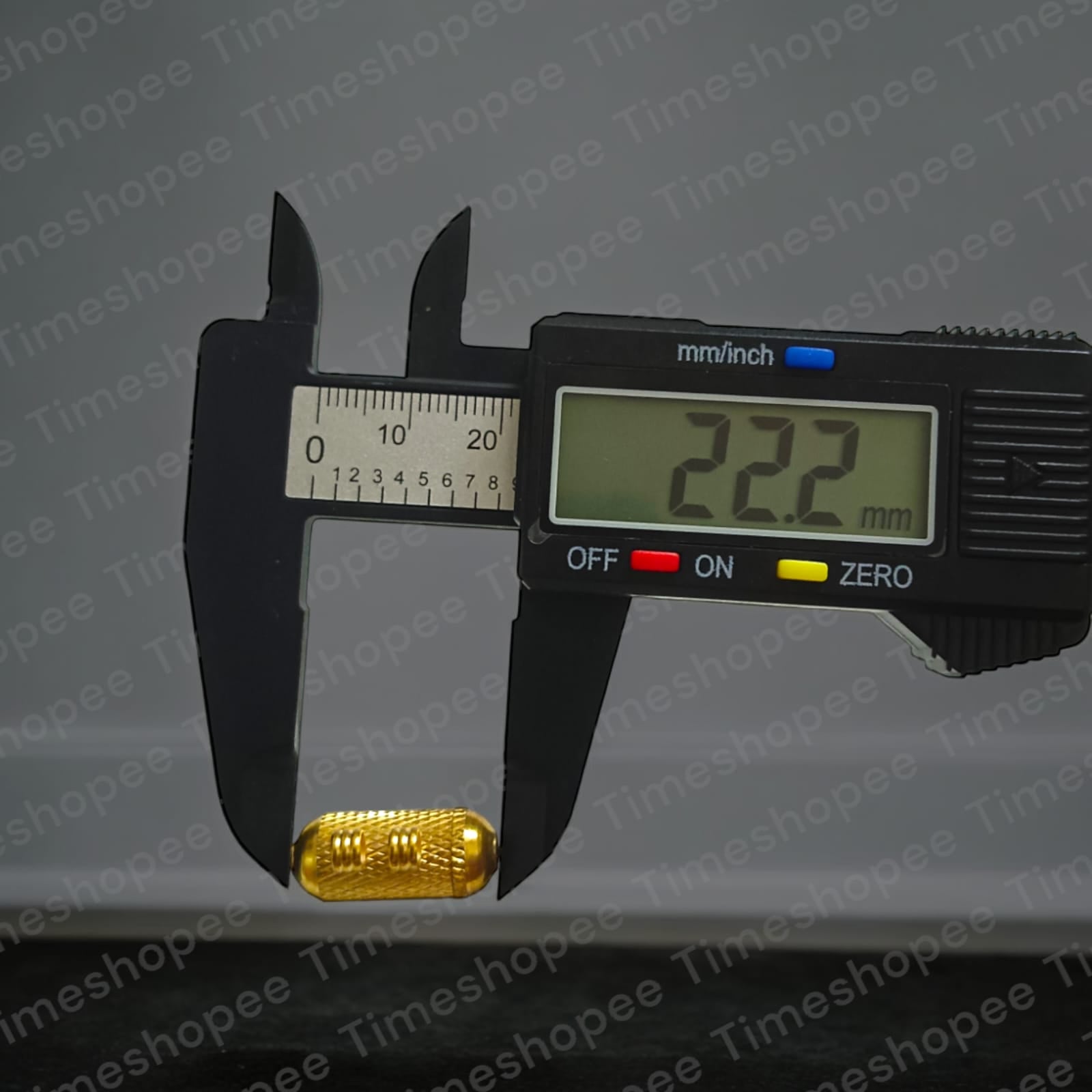 Set of Pure Golden metal taweezes with Bhojpatra sheet, displayed elegantly on a neutral background