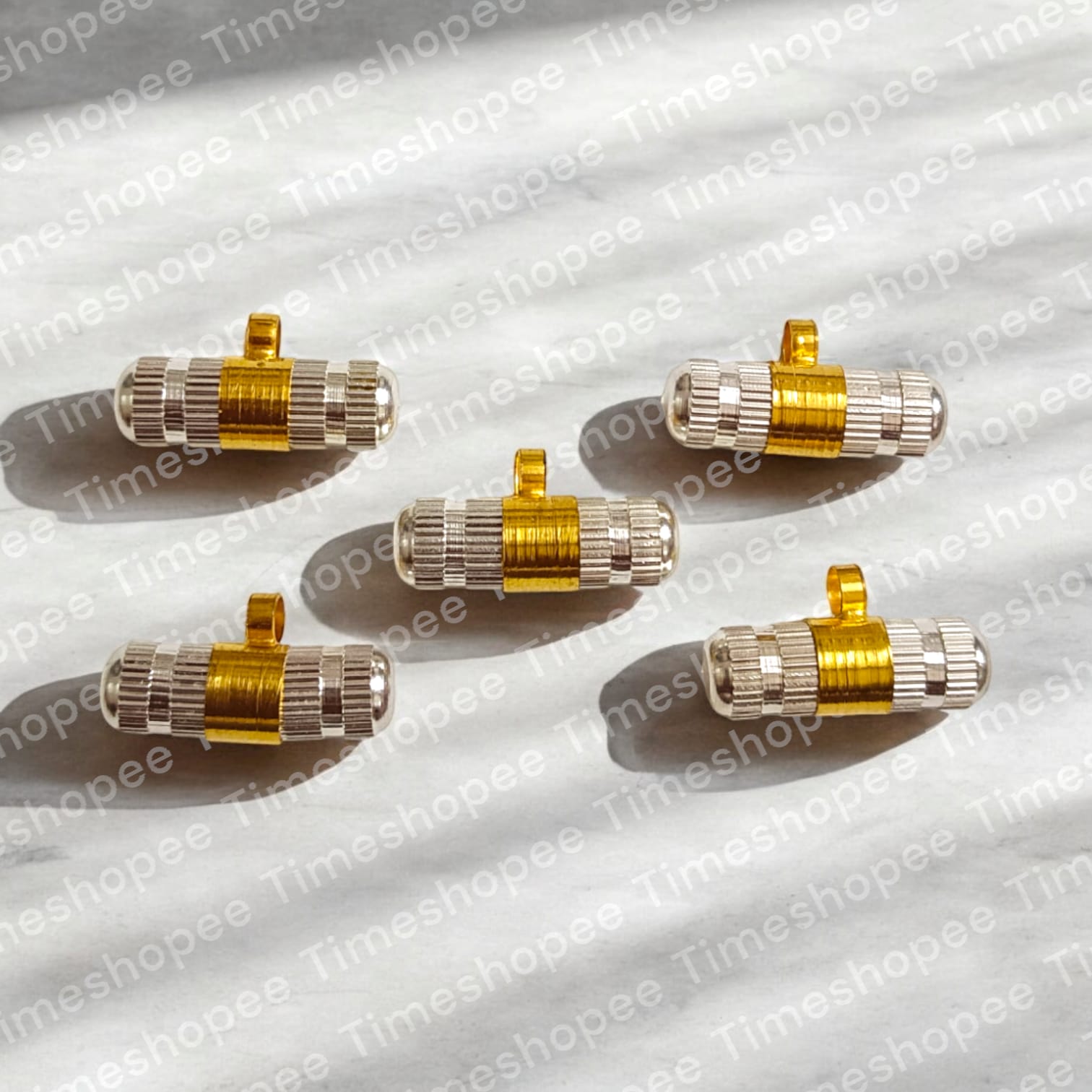 Set of five golden and silver taweez amulets with a Bhojpatra sheet, showcasing their elegant design and spiritual significance.