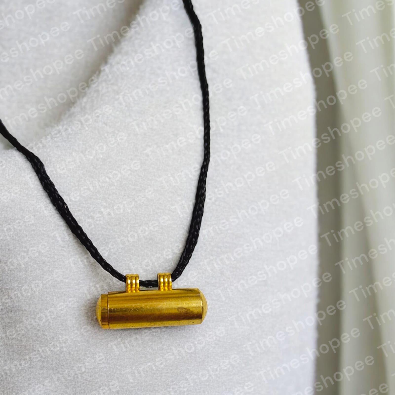 Set of five pure brass taweez amulets in golden color with a Bhojpatra sheet, highlighting their elegant design and spiritual purpose.