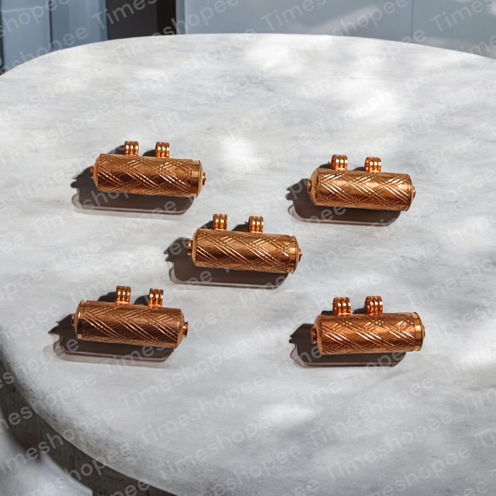 Set of five pure copper taweez amulets, available in small (22mm) and big (23mm) sizes, with a free Bhojpatra sheet, showcasing their elegant design and spiritual benefits.