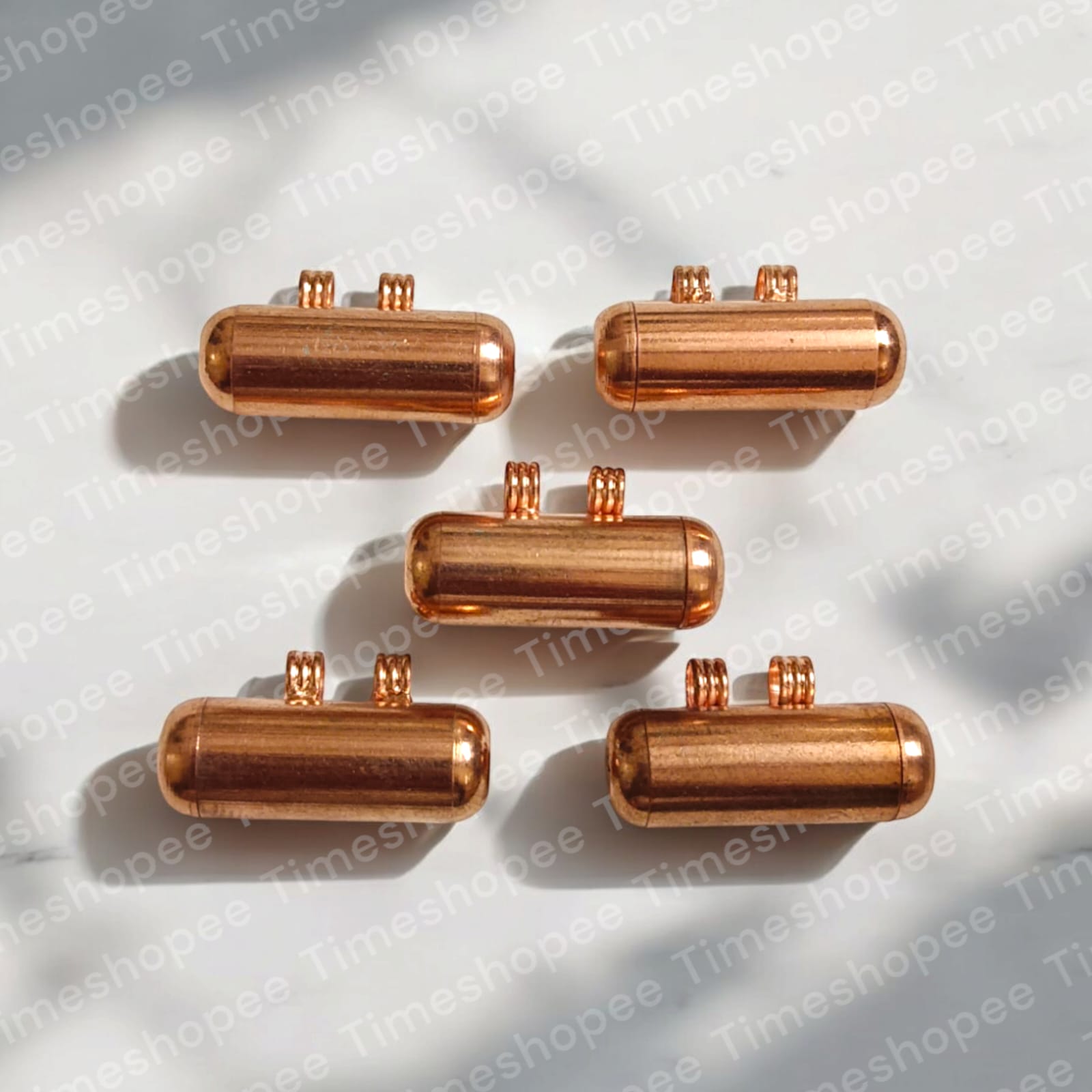 Set of five pure copper taweez amulets in copper color, available in small and big sizes, with a Bhojpatra sheet, showcasing their design and spiritual significance.