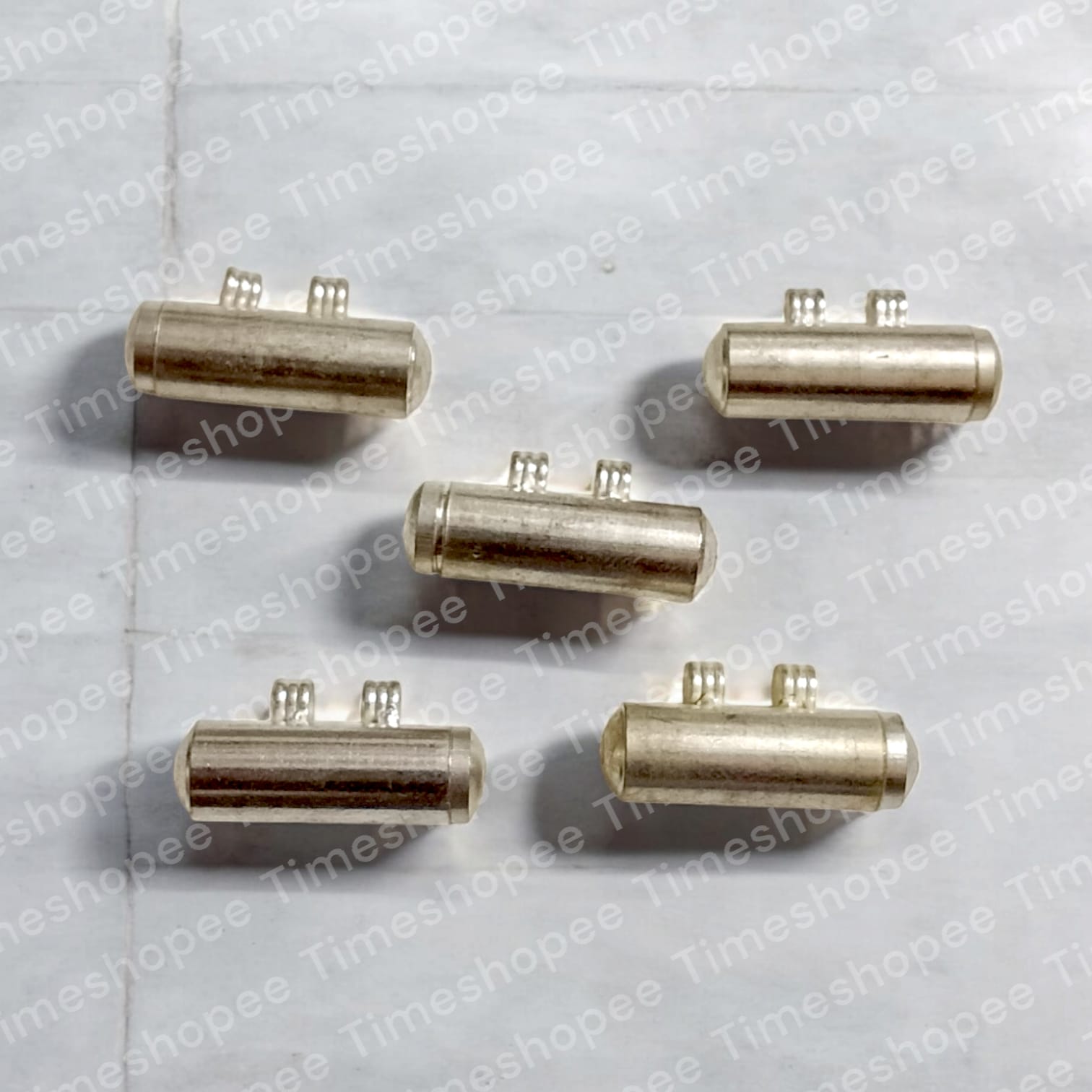 Set of five silver plated taweez amulets in silver color, available in big and small sizes, with a Bhojpatra sheet, showcasing their elegant design and spiritual significance.