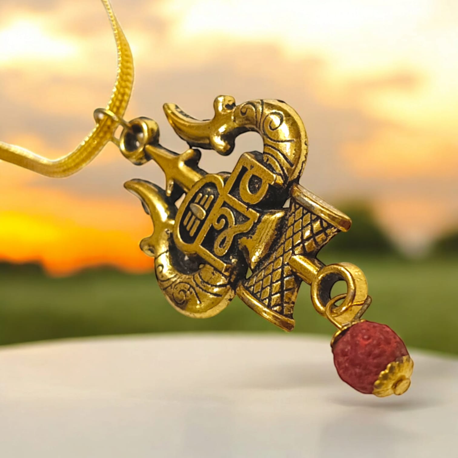 Shiv Locket with Rudraksha, featuring a Shiv Trishul and Damru pendant, gold-plated brass caps, and a free gold chain.