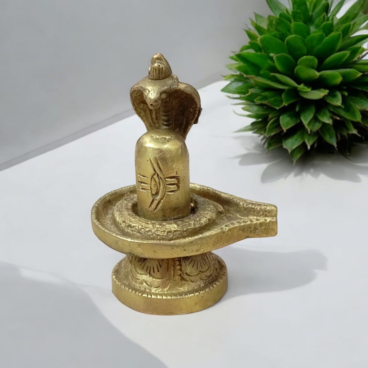 Shivling in Brass with Sheshnaag from Timeshopee, ideal for worship and spiritual decoration.