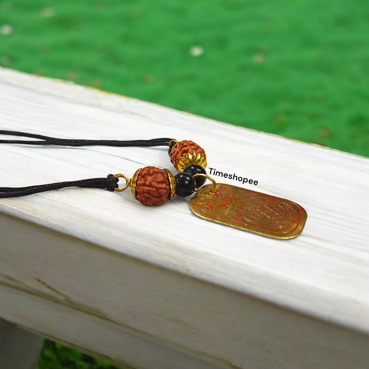 Sidh Bhairav Kavach featuring pure copper locket with 5 Mukhi Rudraksha and Black Agate beads on a black thread by Timeshopee