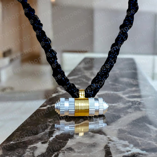 Silver and brass taweez amulets displayed with a Bhojpatra sheet, showcasing their elegant design and spiritual significance.