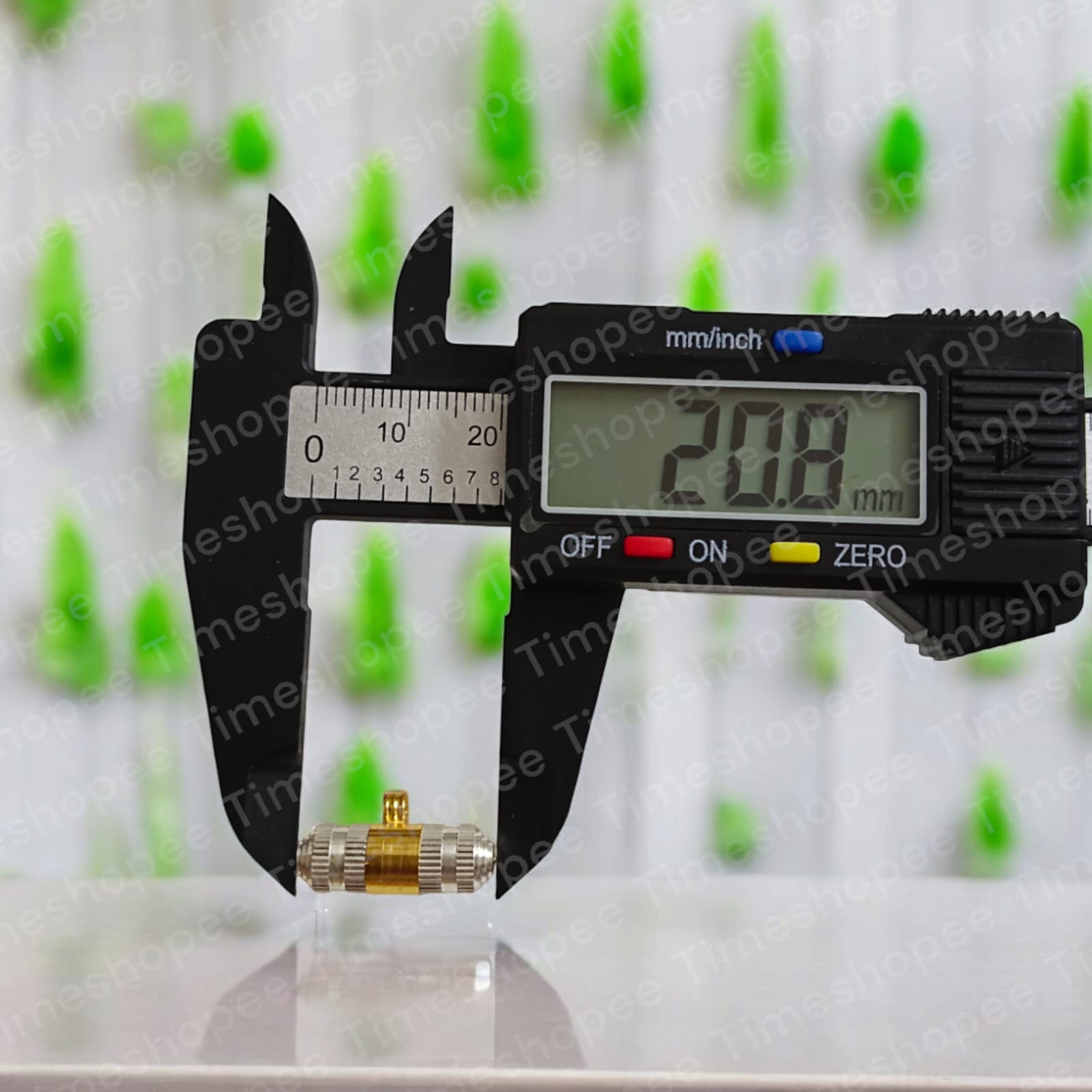 Silver and brass taweez amulets displayed with a Bhojpatra sheet, showcasing their elegant design and spiritual significance.