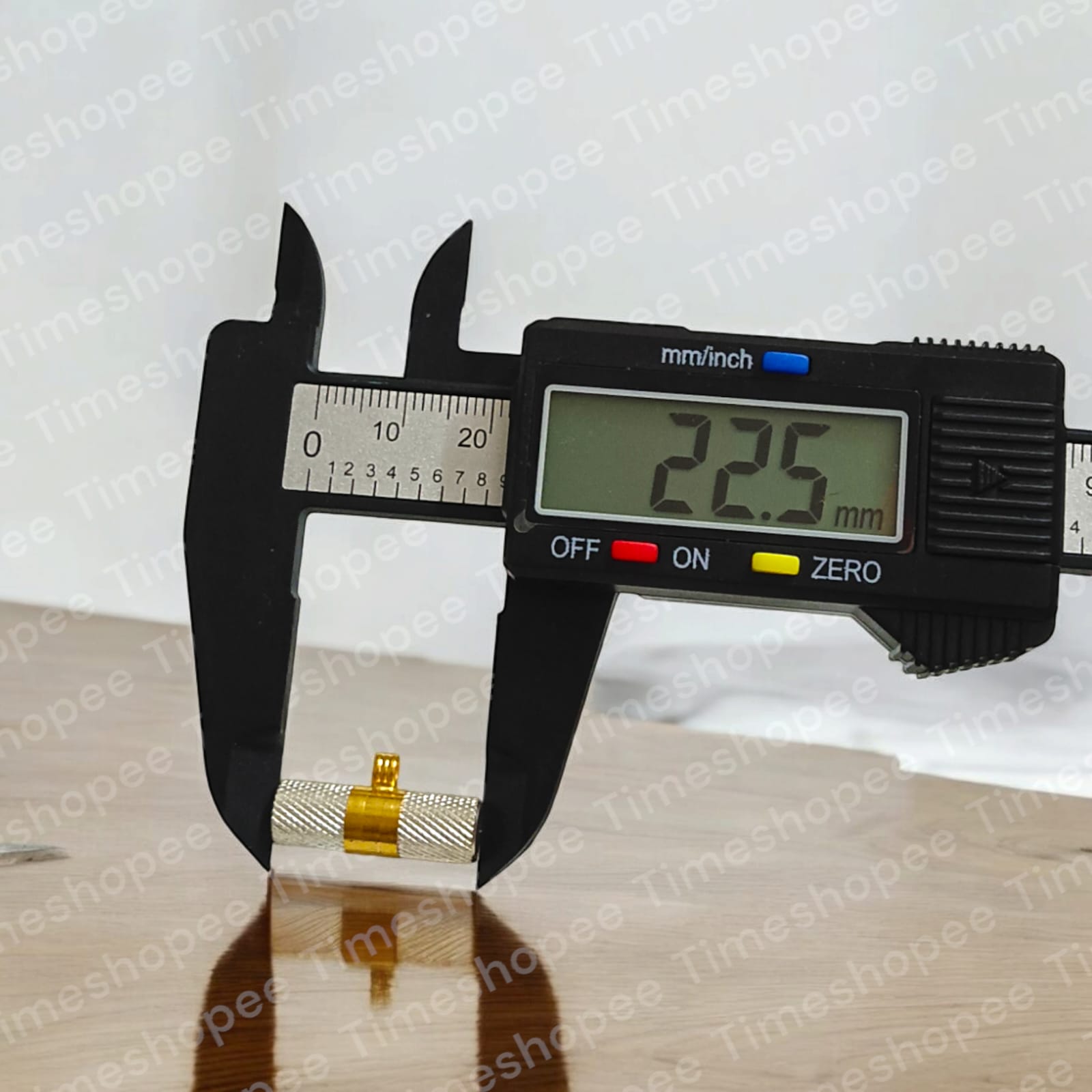 Silver and golden taweezes with Bhojpatra sheet, displayed on a neutral background