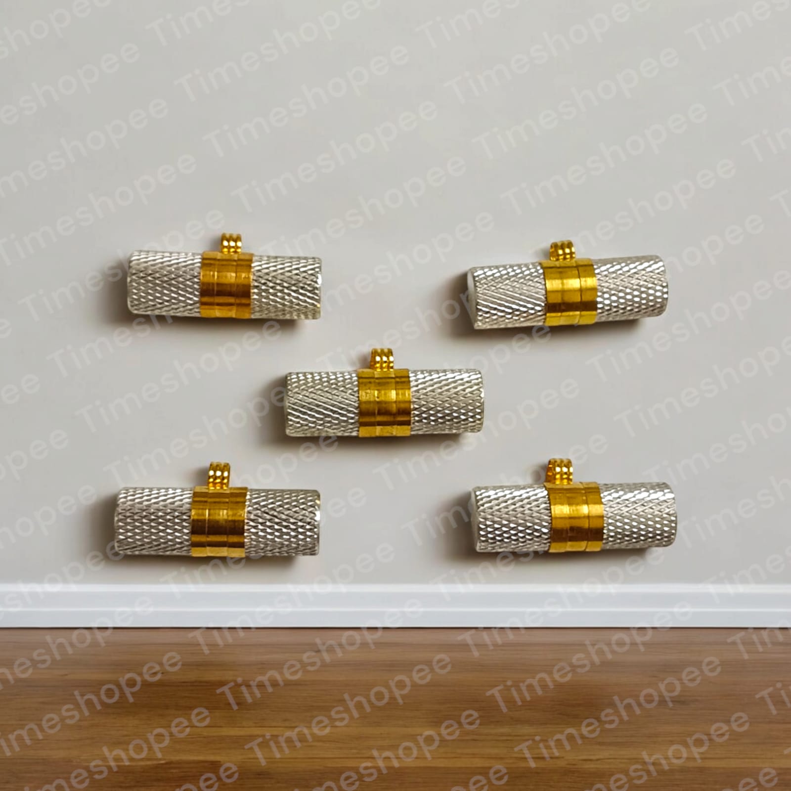 Silver and golden taweezes with Bhojpatra sheet, displayed on a neutral background