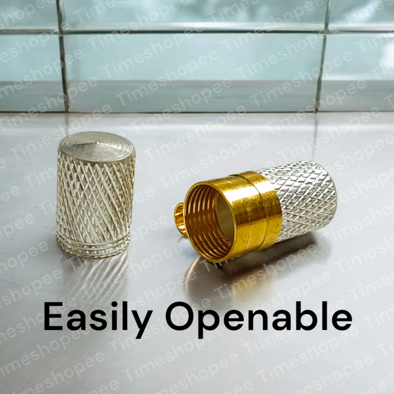 Silver and golden taweezes with Bhojpatra sheet, displayed on a neutral background