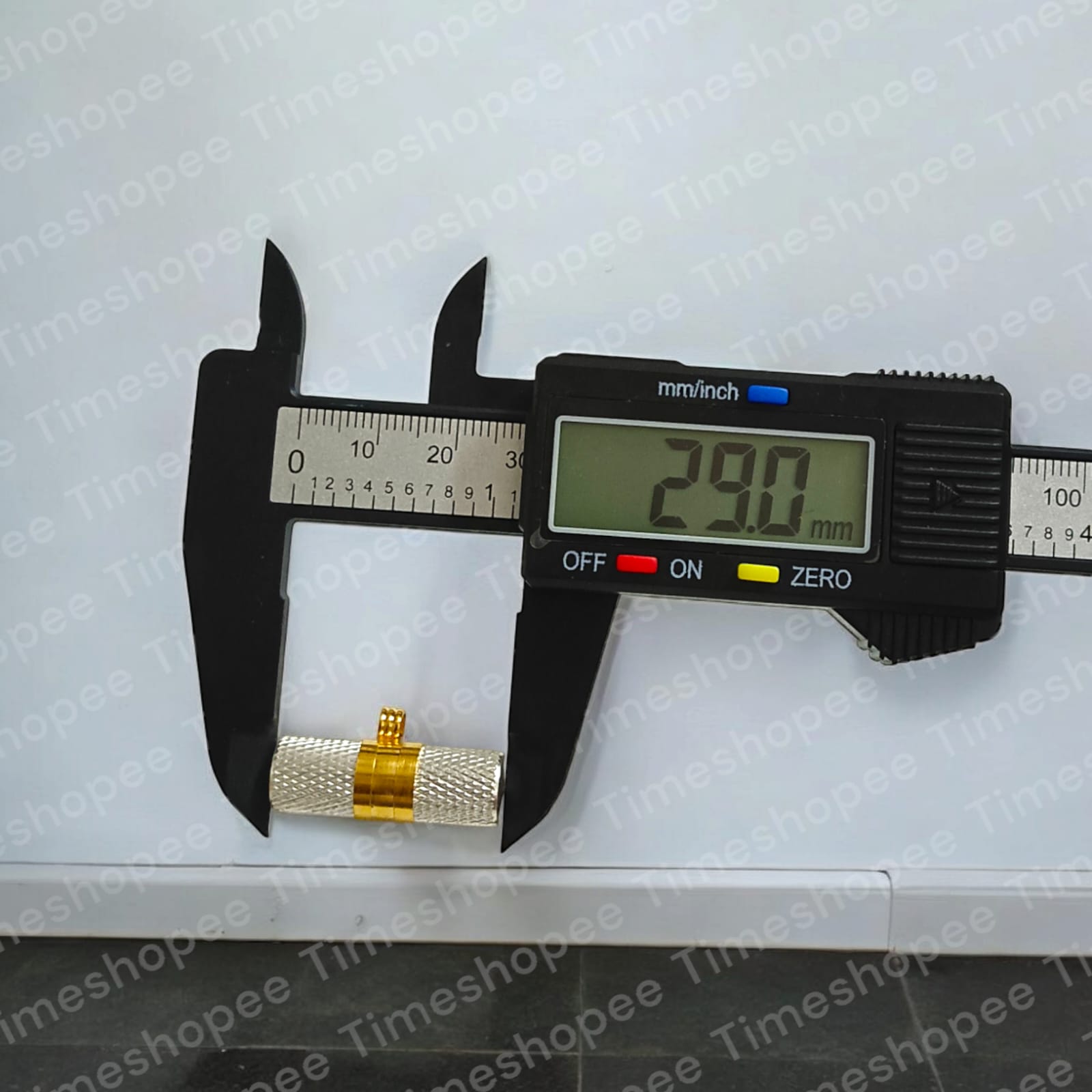 Silver and golden taweezes with Bhojpatra sheet, displayed on a neutral background