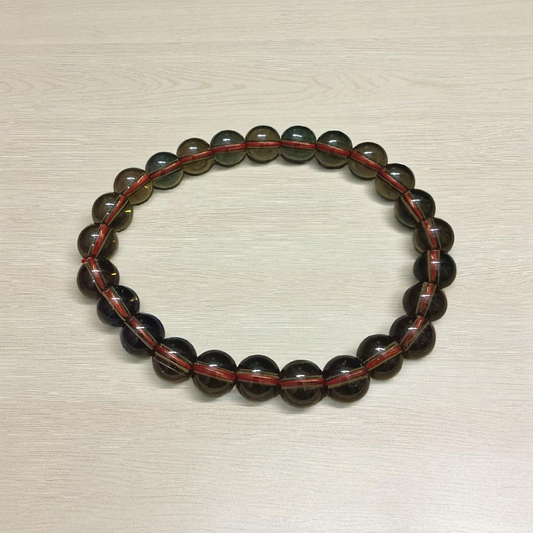 Stretchable Natural Smokey Quartz Bracelet made with 8mm round beads, suitable for men and women, displayed on a white background