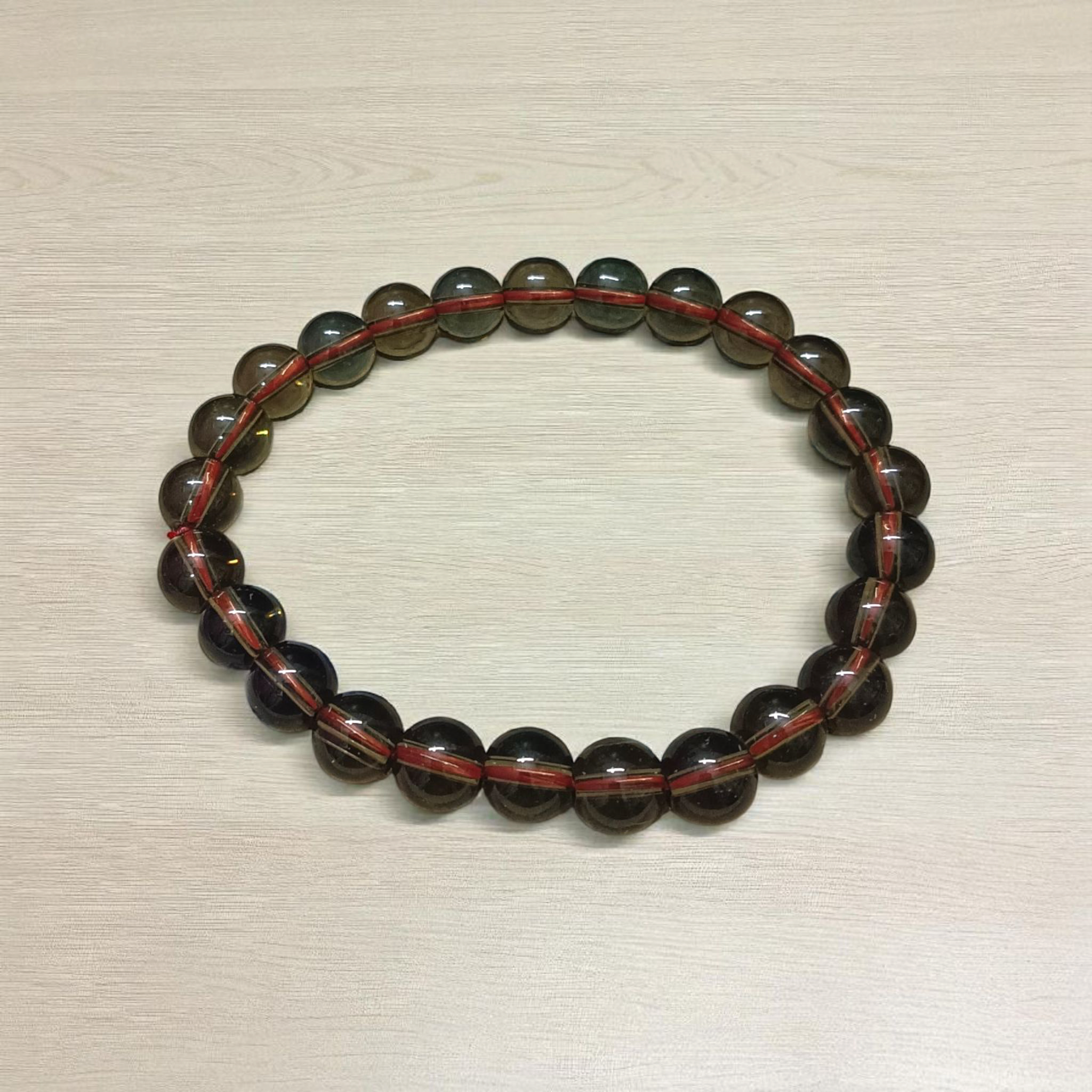 Stretchable Natural Smokey Quartz Bracelet made with 8mm round beads, suitable for men and women, displayed on a white background