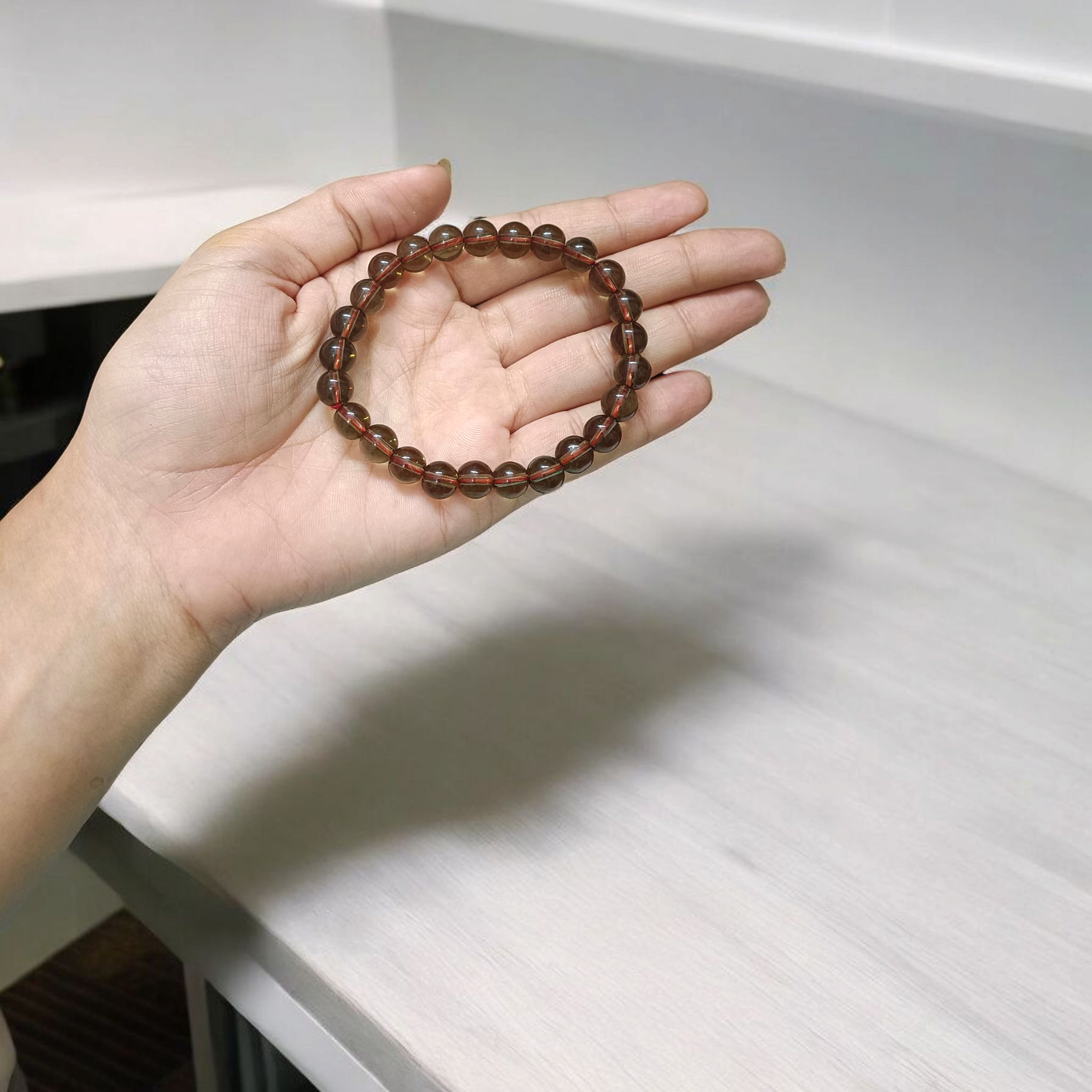 Stretchable Natural Smokey Quartz Bracelet made with 8mm round beads, suitable for men and women, displayed on a white background