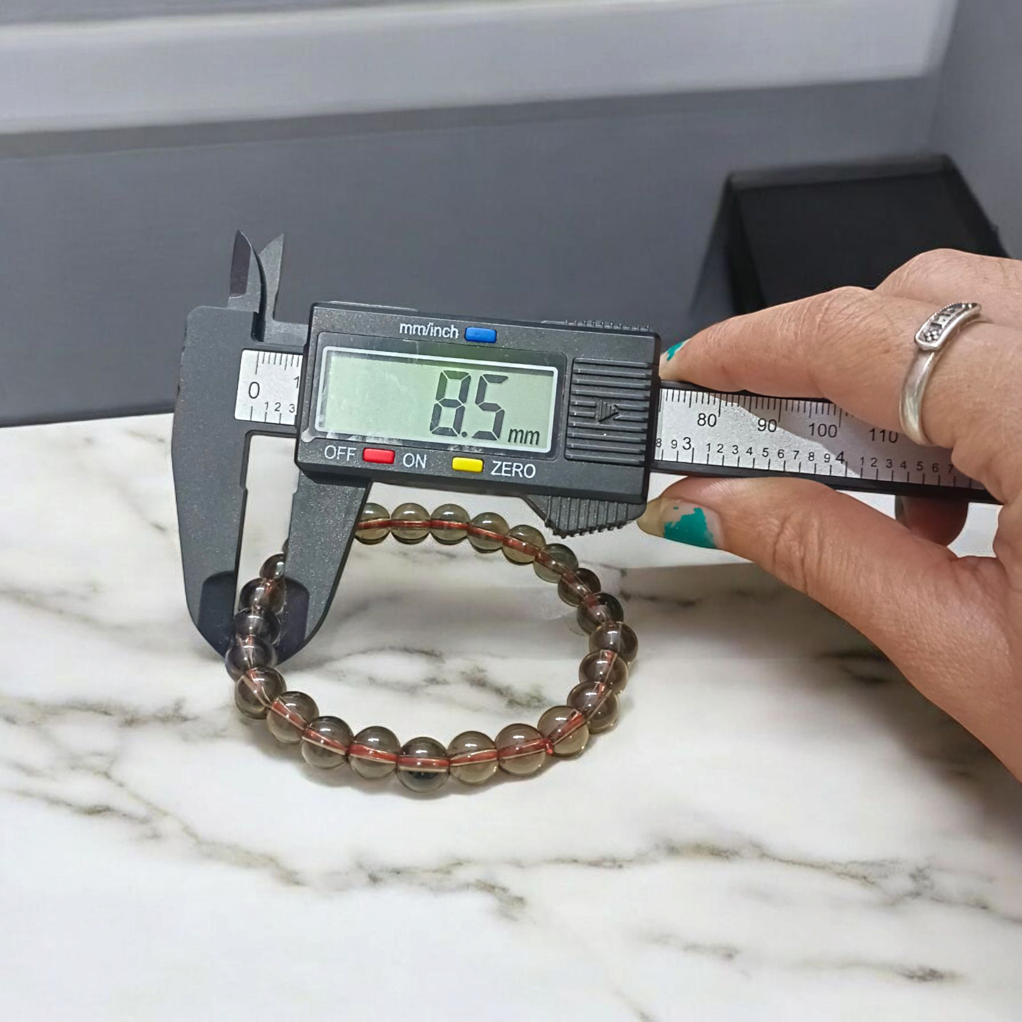 Stretchable Natural Smokey Quartz Bracelet made with 8mm round beads, suitable for men and women, displayed on a white background