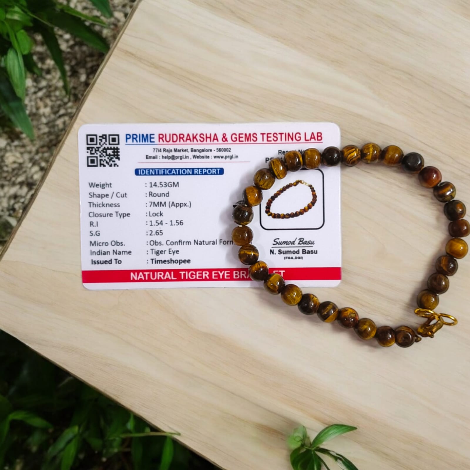 Tiger Eye bracelet, lab certified, available in two styles: stretchable and hook, showcased on a neutral background.