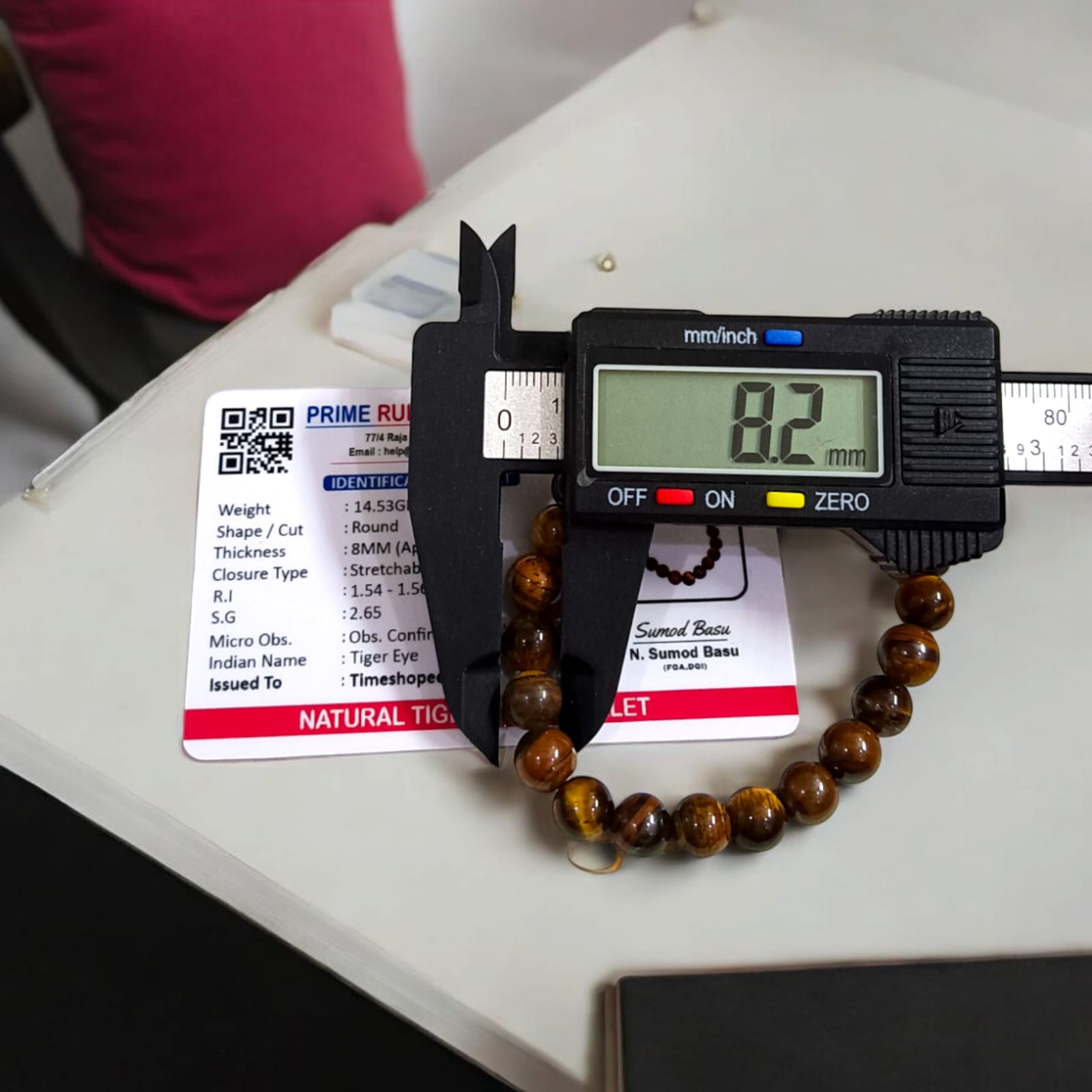 Tiger Eye bracelet, lab certified, available in two styles: stretchable and hook, showcased on a neutral background.