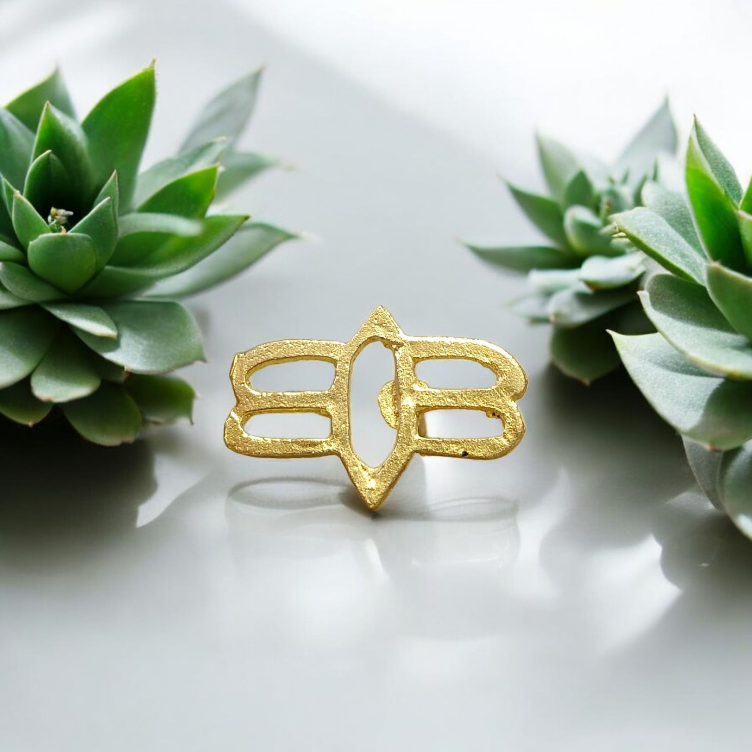 Tripund Tilak Stamp featuring three horizontal lines and a central third eye design, placed next to puja items for forehead marking