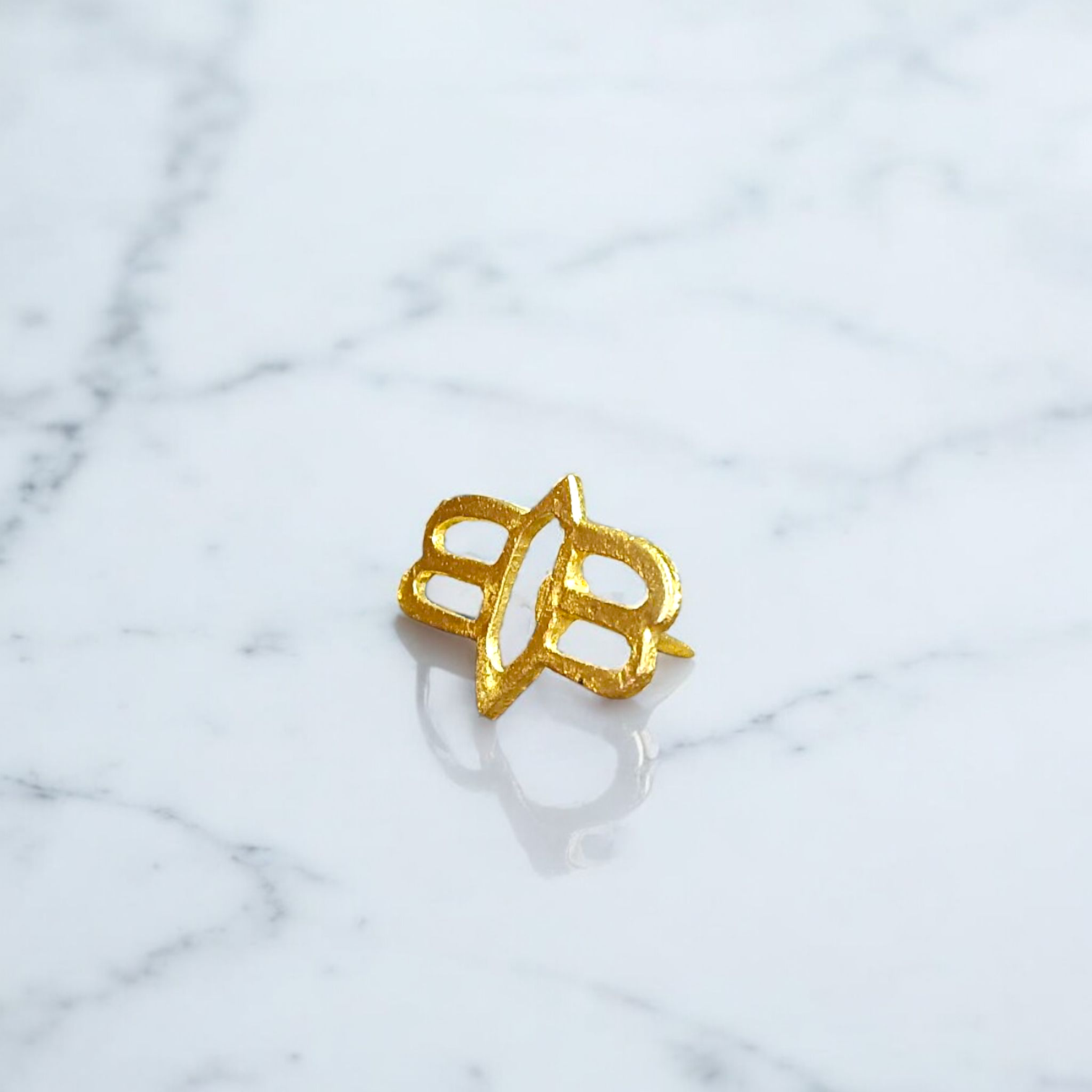 Tripund Tilak Stamp featuring three horizontal lines and a central third eye design, placed next to puja items for forehead marking