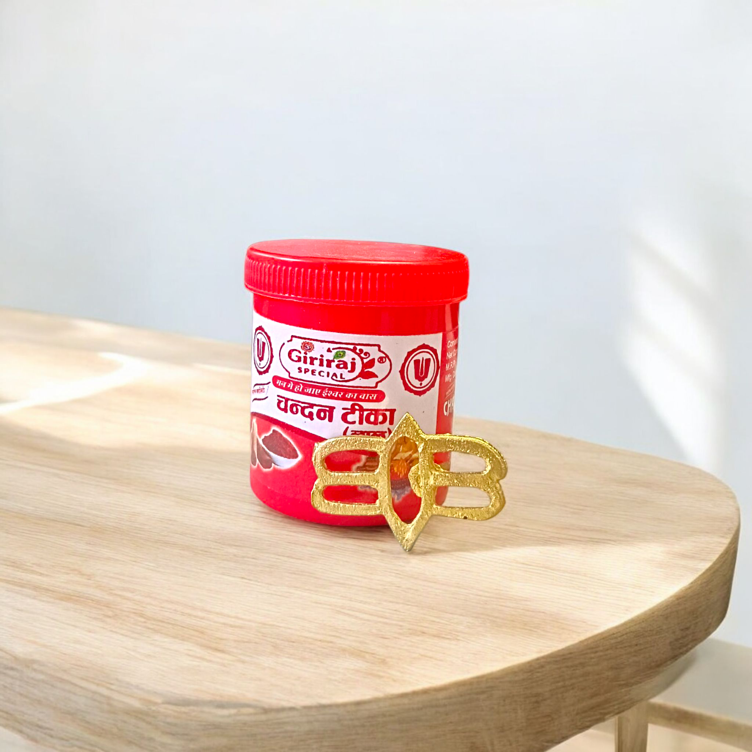 Tripund Tilak Stamp featuring three horizontal lines and a central third eye design, placed next to puja items for forehead marking