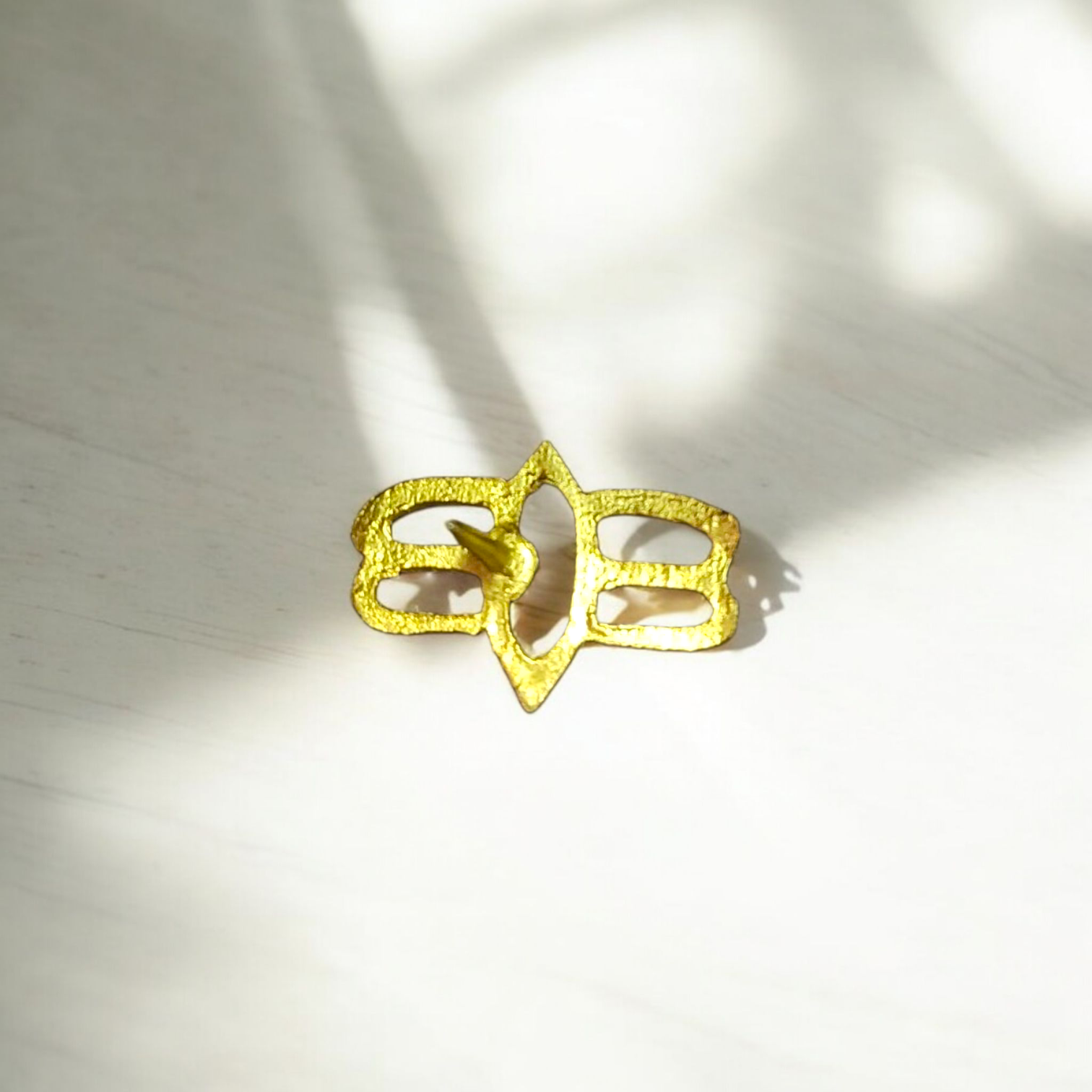 Tripund Tilak Stamp featuring three horizontal lines and a central third eye design, placed next to puja items for forehead marking