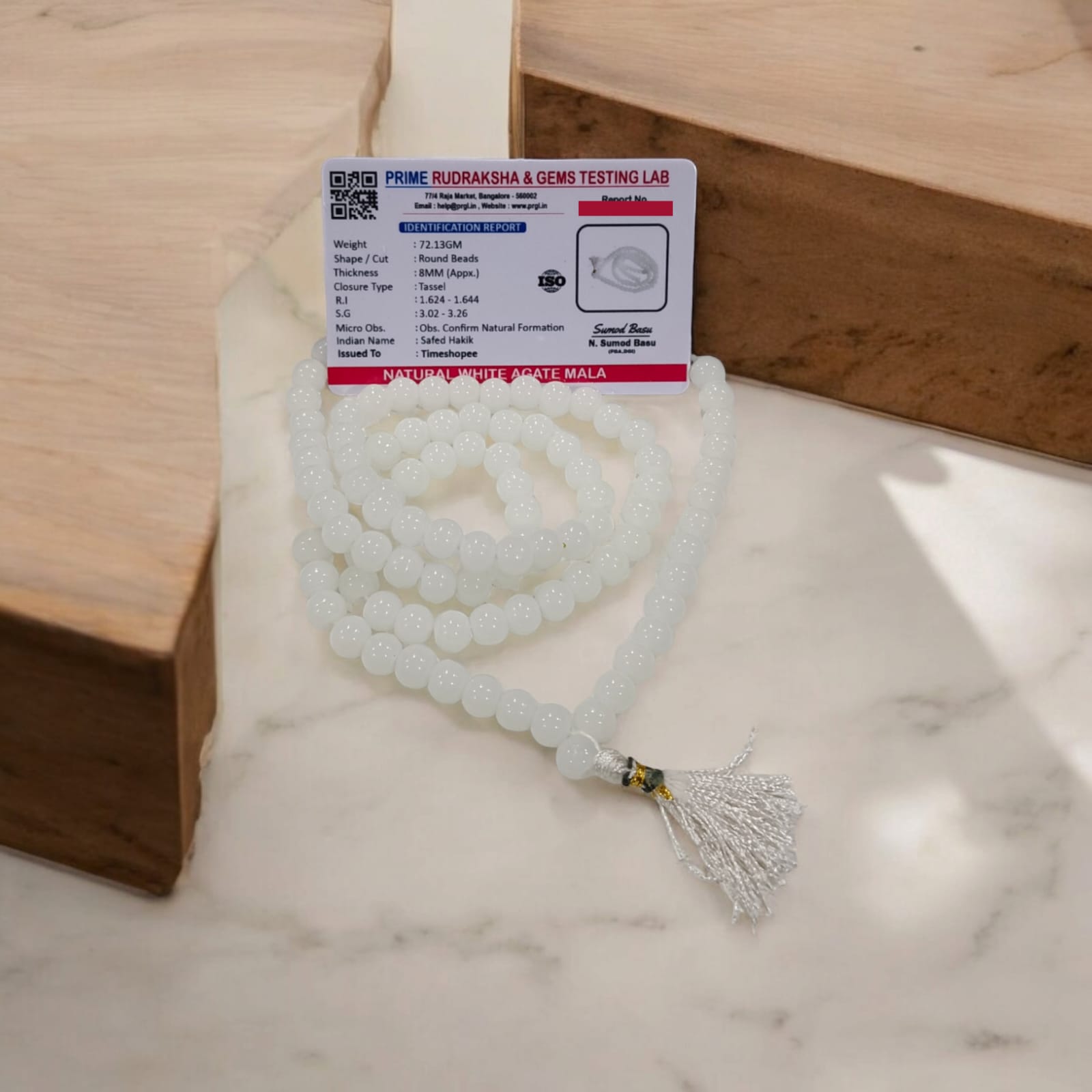 White Agate Mala with 8MM beads and 108+1 bead count, lab-certified for authenticity, displayed in a detailed close-up view.