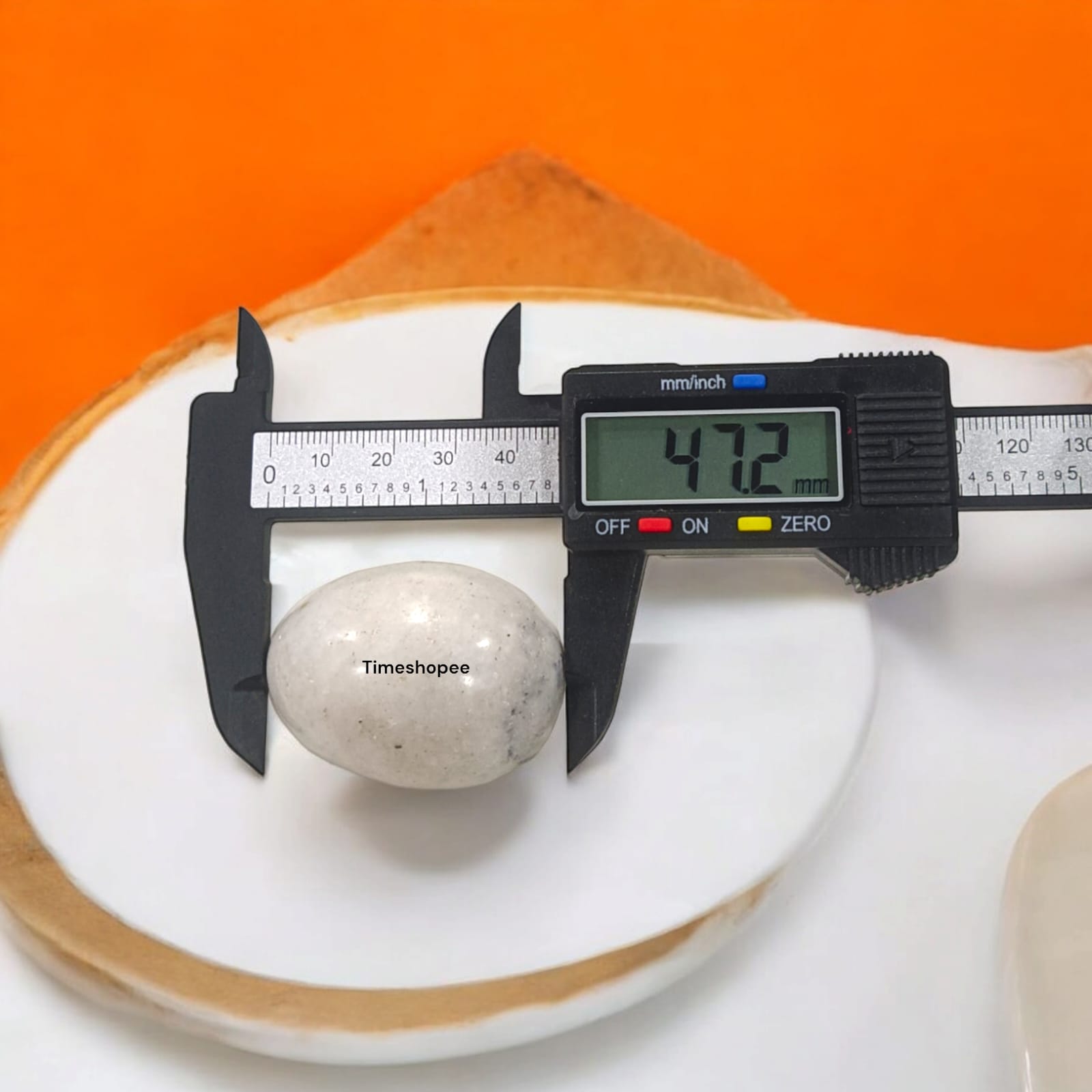White and Black Shivling Stone for Tulsi and temple worship, representing Lord Shiva with an elegant dual-tone marble design.
