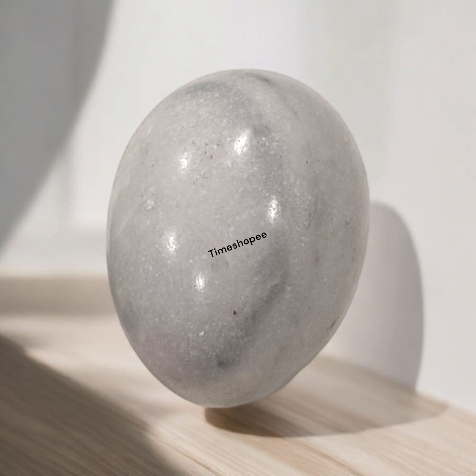 White and Black Shivling Stone for Tulsi and temple worship, representing Lord Shiva with an elegant dual-tone marble design.